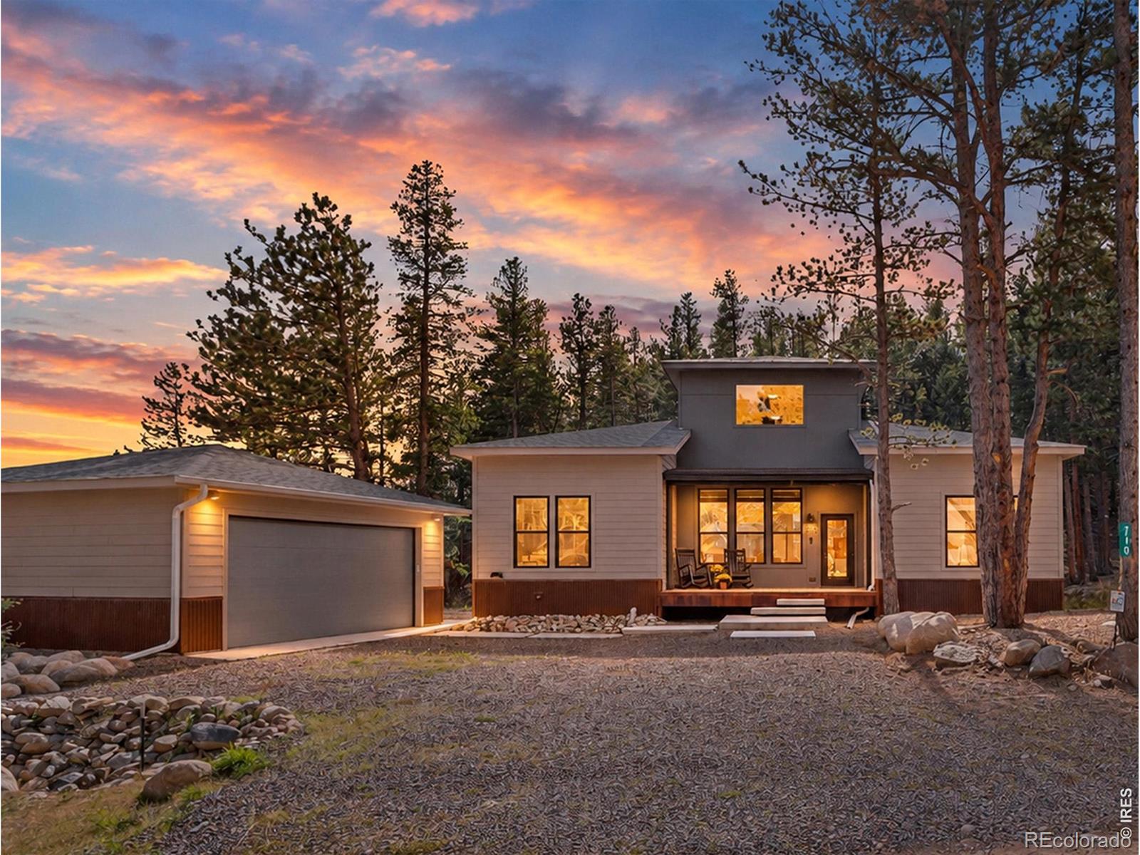 OPEN HOUSE SATURDAY 10/10, 11AM-1PM! Mountain living gets a whole lot easier at 710 McMillen Way. New build with nearly everything you need on the main level, this Nederland home combines modern construction, easy access and outdoor adventure practically at your doorstep. Inside, high ceilings and natural light fill the open layout. The kitchen is built for gathering with a large island, quartz counters, built-in appliances and stainless farmhouse sink. Living and dining spaces flow directly to the rear deck, making it easy to take everyday life outside. The main level includes a spacious primary suite with walk-in closet, dual sinks, soaking tub and separate shower, plus two additional bedrooms, full baths and dedicated laundry. No need to head upstairs unless you want to. And you probably will. The upper level offers a large bonus space for a media room, studio, office or game room, plus one of the home's coolest surprises: a rooftop deck surrounded by mountain air and towering pines. All-electric and energy efficient, the home also features fire sprinklers, natural landscaping and a detached two-car garage. The location makes mountain life remarkably convenient. Downtown Nederland, schools, RTD and everyday amenities are close by, while quick Peak to Peak Highway access makes getting around easy. Eldora Mountain Resort is approximately 3.5 miles away, with National Forest access and the West Magnolia trail system nearby for hiking, biking and exploring. Main-level living, multiple outdoor spaces and mountain adventure close by. Contact to tour 710 McMillen Way, Nederland, CO 80466.