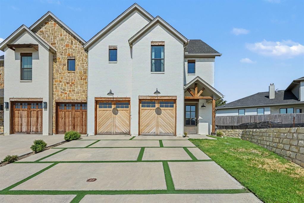 BEAUTIFULLY designed, exceptionally spacious townhome in The Villas Downtown. Ideally located in the heart of Aledo within walking distance of local restaurants, shopping, and the new City Hall and library. Enjoy the charm and convenience of downtown living while being surrounded by beautiful, modern amenities. From the all-white brick exterior to the thoughtfully selected interior finishes, this home offers an impressive combination of style and comfort. HOA maintains the front yard, making exterior upkeep easy and convenient. Step inside to soaring ceilings in the entry foyer and living room, where large windows provide abundant, natural light. Exposed ceiling beams add warmth and character, while stylish finishes create a modern, elevated feel throughout. The dining room features a fireplace and opens to the beautifully appointed kitchen, complete with stone countertops, large island, generous pantry, and eye-catching tile backsplash. The primary suite is located on the main level and features a luxurious ensuite bathroom with dual vanities and walk-in shower. Upstairs, you'll find two additional bedrooms with full bathrooms - along with a fourth bonus room that could be an office, media room, second family area for additional living space or an another bedroom. The laundry room features built-in cabinetry and distinctive brick flooring with a drop zone. The 3-car tandem garage provides extra space for vehicles or storage! Flooring throughout the home includes a beautiful mix of tile, carpet and brick, adding texture and character to each space. Outside, enjoy a covered patio and backyard, perfect for relaxing or entertaining. Turf in the driveway provides a clean, polished appearance with low-maintenance appeal. Situated minutes from I-20, the convenience of this location can't be beat. Click the Virtual Tour link to view the 3D walkthrough. Discounted rate options and no lender fee future refinancing may be available for qualified buyers of this home.