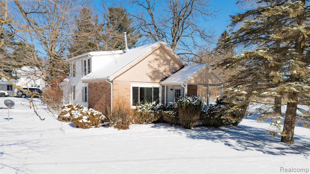 Charming farmhouse on a large lot, right across from Laylin Park! Featuring an added great room with vaulted ceiling, this home offers three bedrooms plus a spacious enclosed living room (separate from the great room) that could serve as a fourth bedroom. The full basement provides abundant storage or potential for extra hobby space. Outdoors, enjoy a sizable yard perfect for gatherings or play. While the property needs some cosmetic updates, it’s full of potential for new owners to personalize and make it their own.  Buyer to assume Ingham County Drain Comm Assessment in the annual amount of $105.27 paid as part of the winter tax bill.