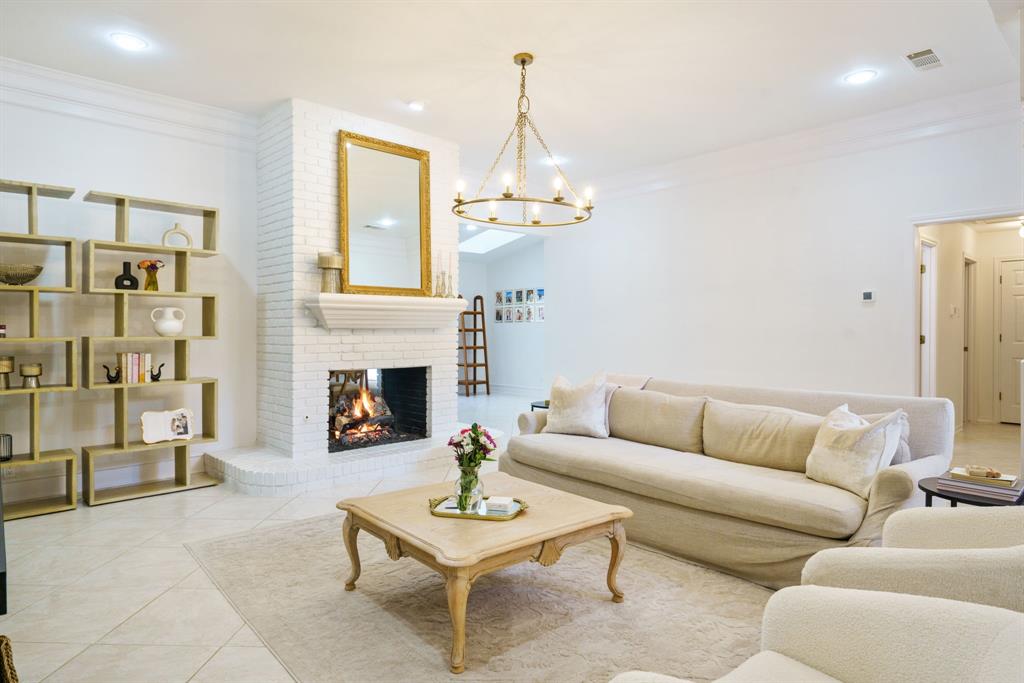 Welcome to this beautifully updated 4-bedroom, 2.5-bath home in Plano ISD with no HOA! Light-filled interiors feature a dramatic double-sided floor-to-ceiling brick fireplace, formal dining, and stylish upgraded light fixtures. The spacious kitchen offers granite counters, gas cooking, a range hood, and a breakfast nook. Retreat to the large primary bedroom with an ensuite spa-like bathroom with views of the pool, soaking tub, separate shower, dual vanities, and his & hers closets. Three secondary bedrooms include a Jack & Jill bathroom layout. A versatile flex space with a bar area is perfect for a game room, playroom, or extra living room. Step outside to your private oasis with a covered patio, sparkling pool and spa, detached pergola, and big side yard. Excellent location with quick access to George Bush Turnpike, I-75, and downtown Plano’s dining and shopping.