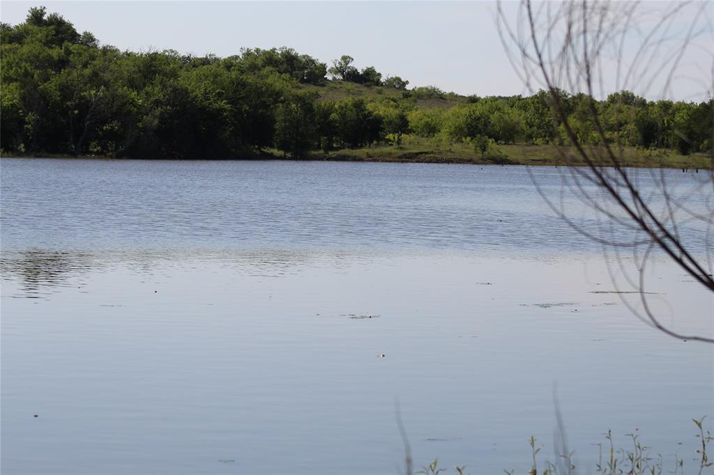 ATTENTION hunters, fishermen, cattlemen or horse owners!  These 40 full acres are ideal for your needs.  Native grass is abundant and there are plenty of trees to enhance hunting opportunities.  A huge bonus for this property is the abutting soil conservation lake, full of fish, on the west boundary.  property is fence on the north side and a temporary electric fence is on the east end.  While not yet filed a deeded easement will be provided for access.