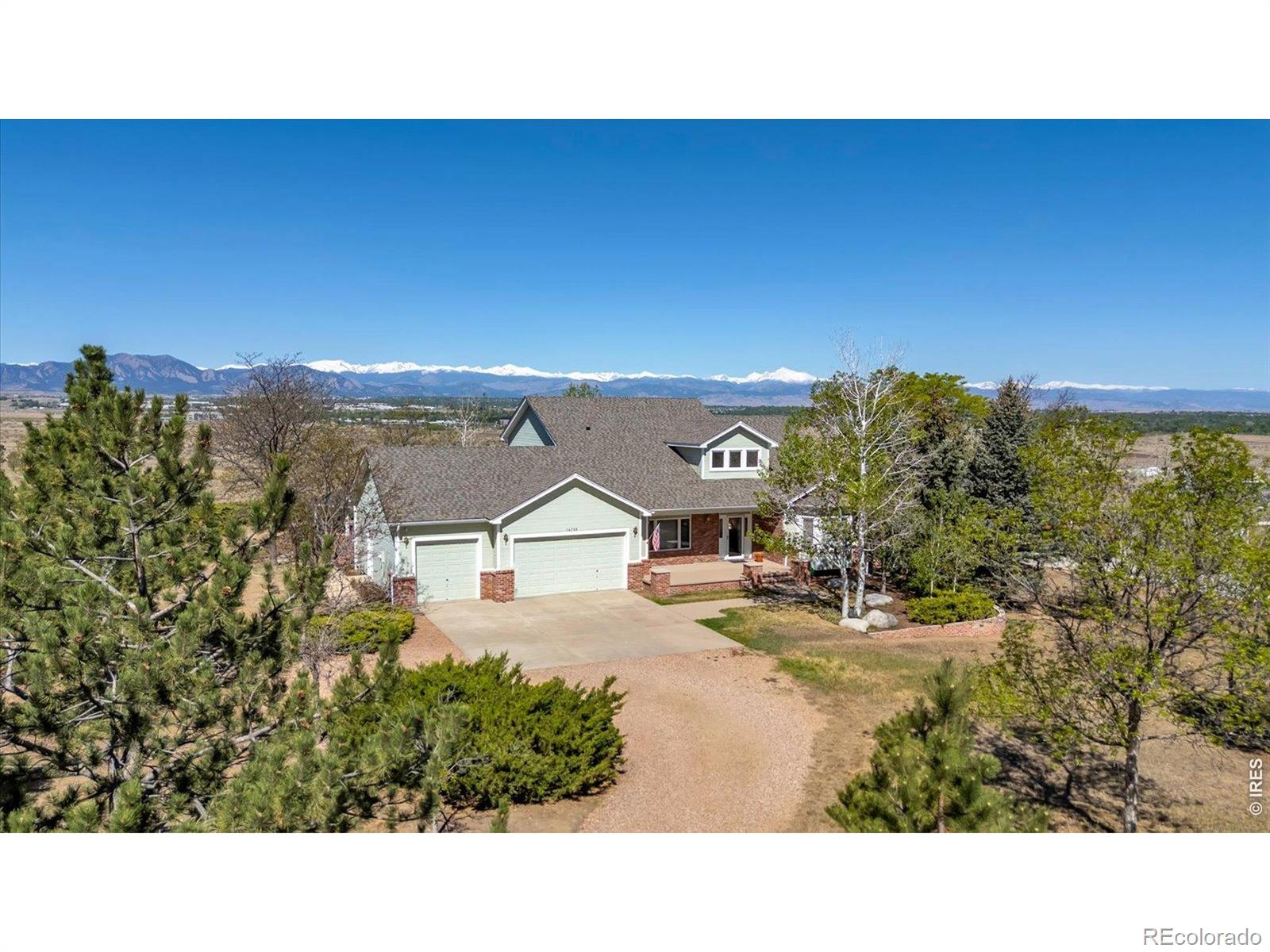 Enjoyment of life lies in the beauty that surrounds us and a feeling of settled peace. There is something rare and special where inspirational panoramic views uplift the heart and nature thriving around you calms the mind and uplifts the spirit. This is such a place. Here is a thoughtfully designed, custom-built home, showcasing entirely uninterrupted and spellbinding vistas across Boulder County Open Space prairie to the Flatirons and Continental Divide beyond. Prime suite, kitchen, secondary bedrooms, living room and the extensively developed outdoor living area all take in the grandeur. A main-level primary suite headlines the well-considered floor plan with a cook's kitchen featuring a butler's pantry, a formal study, and formal dining room, placing the secondary bedrooms on the upper floor. Engineered with 2x6 construction and brick exterior on a buttressed foundation with French drain, this traditional home featuring 9'ceilings, 3'doorways and casement windows is designed and built like few others. The unfinished daylight basement with garden-level windows to the views offers 1400 sqft to fulfil anyone's needs. Original owners have lavished care on every element of this exceptional, traditional home leaving nothing unattended or undone. It is well prepared canvas for the next owners to bring their remodeling visions and live their dreams, free from any constraints of an HOA. It is a truly majestic setting offering tranquil privacy, mesmerizing vistas, and an abundance of nature; a combination of qualities rarely found and seldom obtainable.