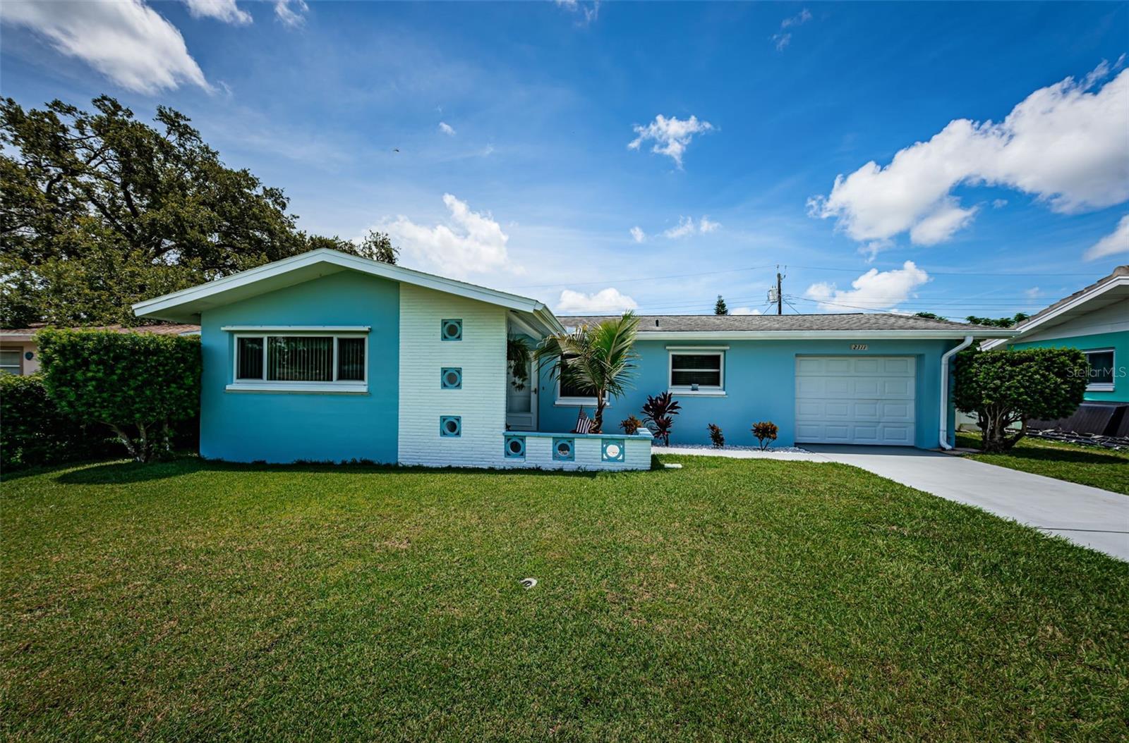 Welcome home to this immaculately maintained 2-bedroom, 1.5-bathroom block construction ranch in the heart of Clearwater! The well-positioned home features an open living and dining room area that leads out to the bright and airy Florida Room. Complete with fresh paint throughout, newer appliances in the kitchen, double-paned windows and hurricane shutters for extra peace of mind. Laundry hookups can be found in the 1-car garage with plenty of room for storage as well. The Roof is only 8-years old and the Electric Water Heater was recently replaced. Relax with your morning coffee in the spacious Florida Room or head out to enjoy the fully fenced in backyard. Irrigation system with well. Close to everything including Clearwater Beach, Downtown Dunedin, St. Petersburg College, Tampa Airport, and so much more! The conveniently located neighborhood doesn’t have an HOA and isn’t in a flood zone which makes it that much harder to pass up. Pop in and have a look for yourself, it is sure to delight!