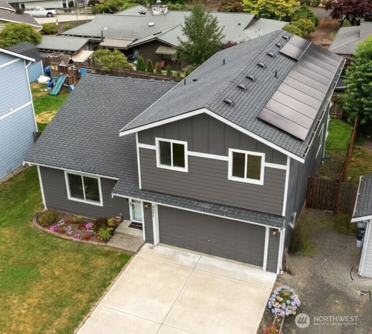 Beautifully maintained one-owner home where thoughtful upgrades, energy efficiency, and inviting spaces come together. Soaring vaulted ceilings and abundant natural light fill the open-concept living, dining, and family rooms, flowing seamlessly into the beautifully upgraded kitchen—perfect for everyday living and effortless entertaining. Enjoy quartz countertops, stainless steel appliances, instant hot water, designer fixtures, and a spacious double-door pantry. Upstairs, retreat to the luxurious primary suite featuring a walk-in closet and stunning custom-remodeled bath. Two additional bedrooms, a full guest bath, and convenient upstairs laundry complete the upper level. All appliances stay! Designed for comfort and efficiency, this home features solar panels, an energy-efficient heat pump, Ecobee Smart Thermostat, and wiring/plumbing in place for an EV charger or future hot tub. Enjoy added peace of mind knowing all exterior siding was replaced and professionally painted just two years ago. The fully fenced backyard is ready for year-round enjoyment with a covered deck, sunny patio, Smart irrigation in both front and back yards, and dedicated pot waterers. Ideally located just minutes from Hwy 16, shopping, restaurants, schools, ferry access, and nearby military bases, this exceptional home offers the perfect blend of modern convenience, everyday comfort, and lasting value. Simply move in, relax, and start making memories from day one.