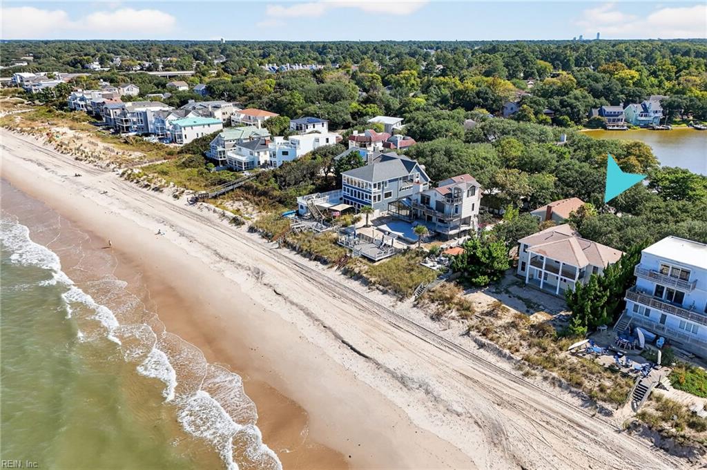 Rare Bayfront Opportunity in Chesapeake Beach! Discover coastal living at its finest with this unique single-family home boasting 75 feet of bulkheaded beachfront on the Chesapeake Bay. This rare find offers 2,122 square feet of living space, featuring 5 bedrooms and 3 full bathrooms — the perfect canvas to create your dream beach home. Seller's have proposed plans for a third story and garage addition! Enjoy stunning water views from both upper and lower decks, ideal for relaxing, entertaining and soaking up the summer breezes. With direct beach access and the privacy of a detached residence, this home offers a true waterfront lifestyle in one of Virginia Beach’s most sought-after communities. Whether you're looking for a serene primary residence, a weekend retreat, or an investment opportunity, this bayfront gem invites you to make it yours. Don’t miss your chance to own a slice of a bay front paradise — opportunities like this are truly rare!
