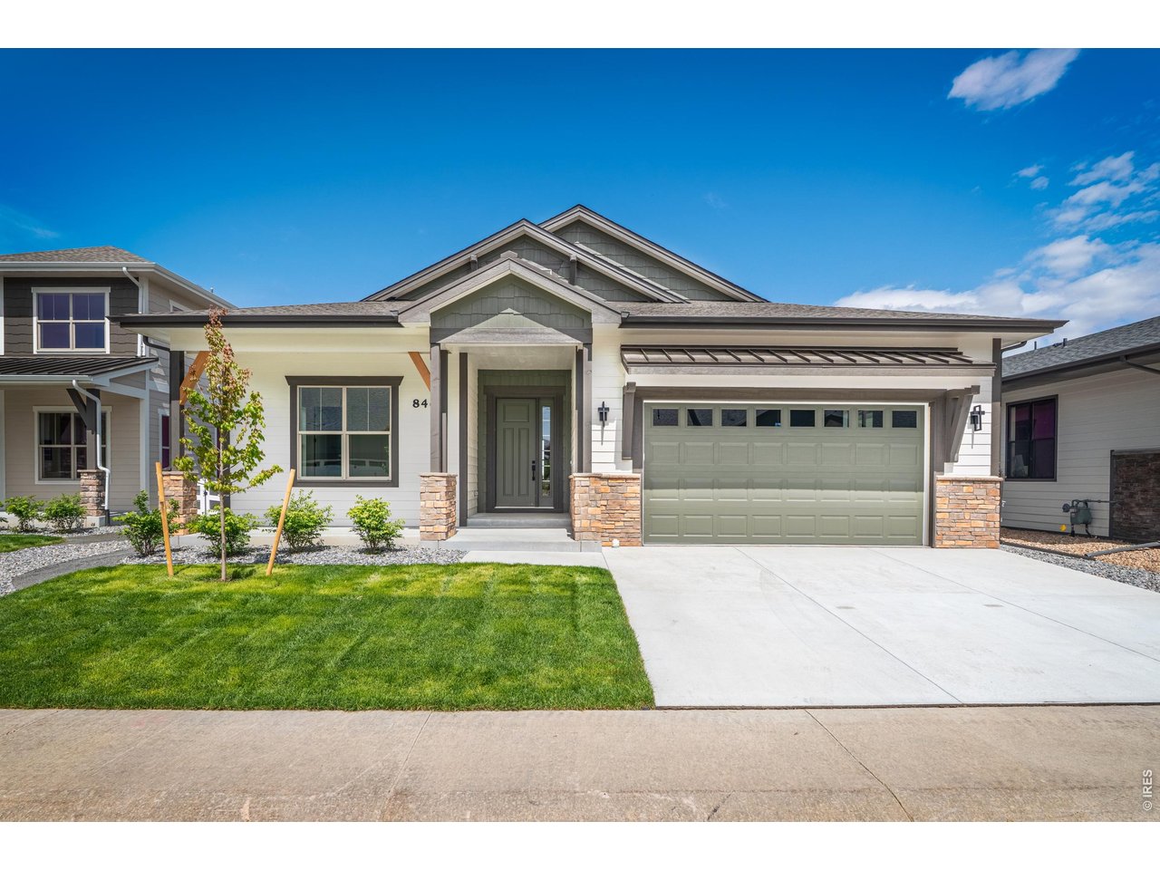 Fricke Custom Homes doesn't cut corners, and you'll feel it the second you walk in. This 2026 ranch offers beautifully curated main-level living - the primary suite, a second bedroom and full bath, a dedicated office behind French doors, a powder room, and laundry are all on the main floor. No stairs to climb to live your day. The kitchen anchors it all: a big quartz island, soft-close cabinetry, stainless appliances, and a gas range with hood, open to a living room with a tiled floor-to-ceiling fireplace. Engineered wood runs throughout. The primary suite is tucked away for privacy with a large walk-in shower and generous closet space. There's more than $35,000 in upgrades built in that the price doesn't account for - plus the extras you don't always see: a fully insulated 3-car tandem garage (a step most production builders skip), a tankless water heater, dual-zone HVAC, a high-efficiency furnace, and double-pane windows. The basement is fully finished - a rec room, two more bedrooms and a full bath, and a wet bar with quartz counters, a full-size fridge, and a dishwasher. Plenty of room to spread out or for guests or family when they visit. Out back, a covered Trex deck with iron railing looks out over a fully landscaped yard that backs to open space, sprinklers already in. The community offers a pool, hot tub, fitness center, tennis courts, and clubhouse. Minutes to I-25 with easy access to Fort Collins and Loveland. Preferred lender offering rate buy down and/or closing credit!