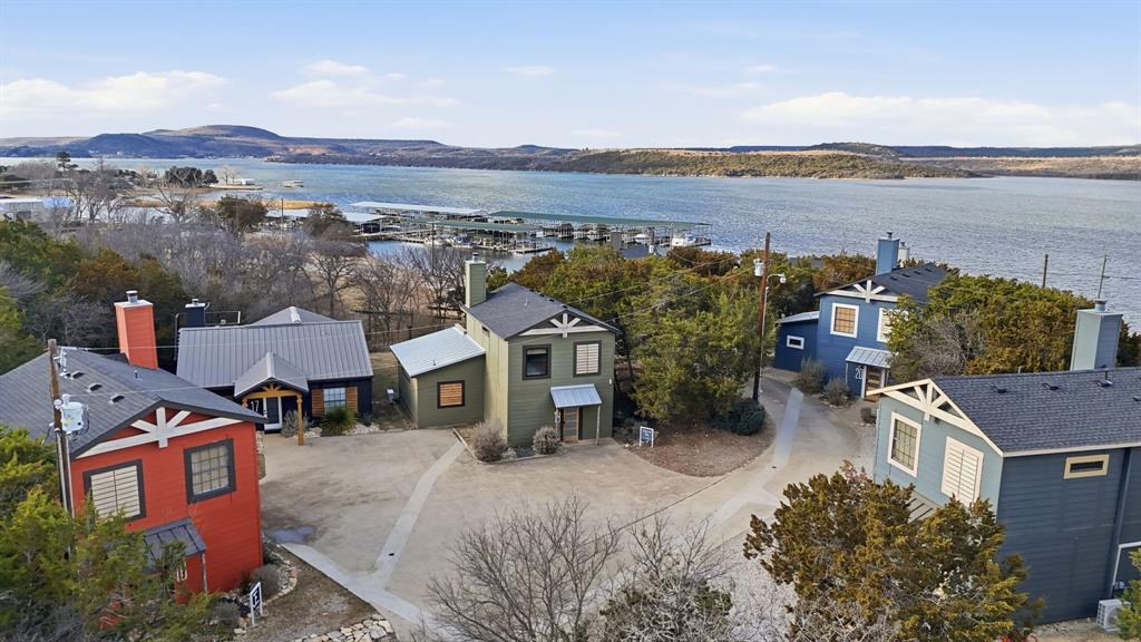 Charming cottage-style lake retreat perfectly positioned on the peninsula with beautiful lake views and unbeatable access to everything you love about lake living. This 3-bedroom, 2-bath home is being offered fully furnished, making it truly turnkey and ready for immediate enjoyment or rental income.Enjoy access to the resort-style pool overlooking the lake, just steps away, and take advantage of the rental-friendly community for excellent investment potential. Whether you’re relaxing on the patio, entertaining guests, or heading out to nearby restaurants just minutes away, this property delivers the ideal blend of comfort, convenience, and lifestyle.A perfect weekend escape, or income-producing lake getaway — this one checks all the boxes.