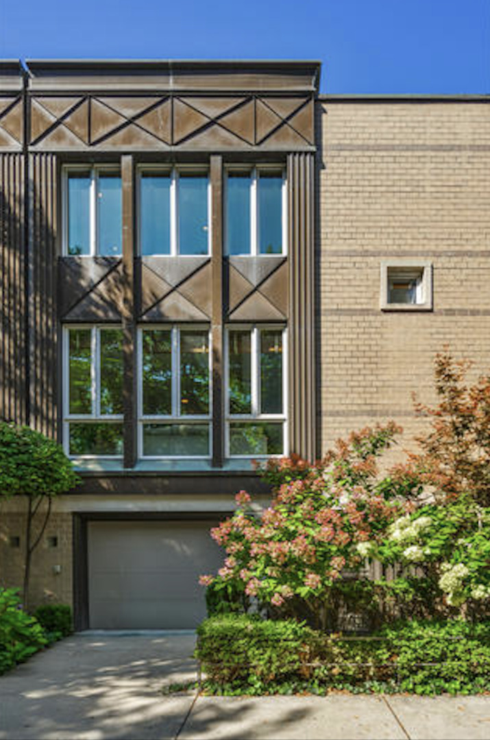 Nestled on a charming tree-lined street in the highly sought-after Oscar Mayer school district, this thoughtfully maintained fee simple townhouse blends timeless design with modern upgrades. Designed by Booth Hansen, the home offers bright, inviting living spaces across three levels. The main level features rich hardwood floors, a dual-sided gas fireplace, and an open layout that connects living and dining areas. The eat-in kitchen has been updated with some new high-end appliances, custom cabinetry, granite countertops, and a tasteful backsplash, flowing seamlessly to an outdoor deck which is perfect for entertaining, grilling, or enjoying peaceful evenings outdoors. Upstairs, the primary suite offers a spacious walk-in closet and a spa-like bathroom with a glass-enclosed walk-in shower and refined finishes. A second bedroom enjoys serene tree-lined views, accompanied by a beautifully renovated bathroom with fresh grout work. The lower level offers a flexible space ideal for an office, guest room, or den, along with a powder room (plumbed for a conversion to a full bath). This level opens to a paved, covered outdoor area designed for year-round enjoyment. Additional upgrades include fresh paint and trim throughout, a new washer, updated electrical work, and a refreshed deck with new stairs. Located just steps from Oscar Mayer Elementary, the 606, Armitage EL, and the Clybourn Metra, the home offers unparalleled access to neighborhood favorites including Trader Joe's, Whole Foods, Pequod's Pizza, and a vibrant selection of local shops and restaurants.
