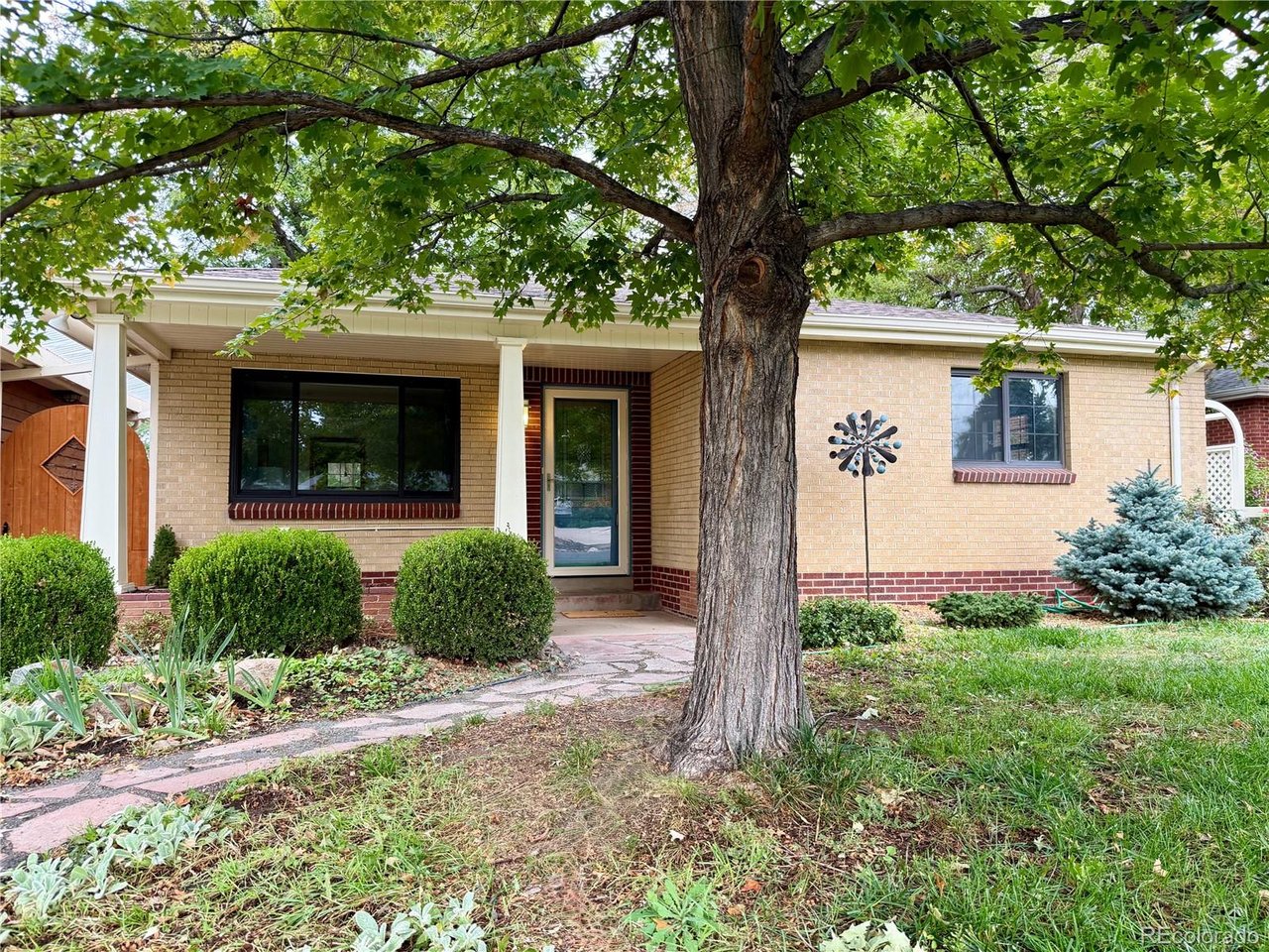 Welcome to this beautifully maintained ranch-style home in the heart of Wheat Ridge, where timeless character meets thoughtful updates and exceptional outdoor living. The main level offers easy, one-floor living with 3 bedrooms and 2 baths, beautiful hardwood floors and coved ceilings, an inviting living room, and a dining room with sliding doors opening onto one of many patios. The updated kitchen features cherry cabinets, quartz countertops, stainless steel appliances, and a built in work area. A truly special feature is the 308 square foot heated studio, increasing the finished available square feet to over 1,500, with its own entrance-ideal for a private home office, creative studio, or home-based business. The space also opens directly to a covered patio, creating a versatile extension of the living area. Set on an impressive 12,110-square-foot lot with mature trees, the outdoor spaces are made for entertaining and relaxing, with a beautiful flagstone patio that wraps around the home, two pergolas, and multiple areas to gather. An oversized garage offers abundant room for vehicles, storage, hobbies, or projects, while an additional shed provides even more storage. All of this in a fantastic Wheat Ridge location with convenient access to Panorama Park, shopping, dining, entertainment, Downtown Denver, I-70, and 6th Avenue. A rare combination of comfortable main-floor living, flexible workspace, and exceptional outdoor space in one of Wheat Ridge's most convenient locations.