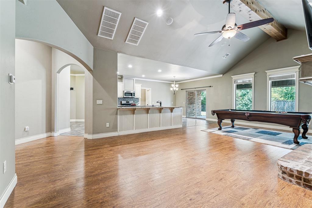 Stop Searching!!  Conveniently located in Hidden Prairie this is the home you have been waiting for!!! Step inside the foyer —to the right an office (or playroom) with vaulted ceiling, bookcases, and glass French doors—ahead is the great room that features wood floors, floor to ceiling cased windows, vaulted ceiling with majestic beam, and beautiful brick fireplace.  The great room is open to the kitchen and dining area.  The kitchen is a chef’s dream with 2 islands, breakfast bar, granite counter tops, stainless steel appliances, and an enormous pantry.  The private main bedroom suite offers a wall of windows and spa like bath with double vanity, granite counter tops, soaking tub, walk-in shower, & walk-in closet.  A large laundry room and beautiful guest bath finish off the downstairs.  Upstairs there are 3 more bedrooms and full bath with double vanity.  Out back is a huge, covered patio with firepit—perfect for entertaining.  This home also provides a full set of solar panels—no more electric bills!!!  Welcome Home!!!