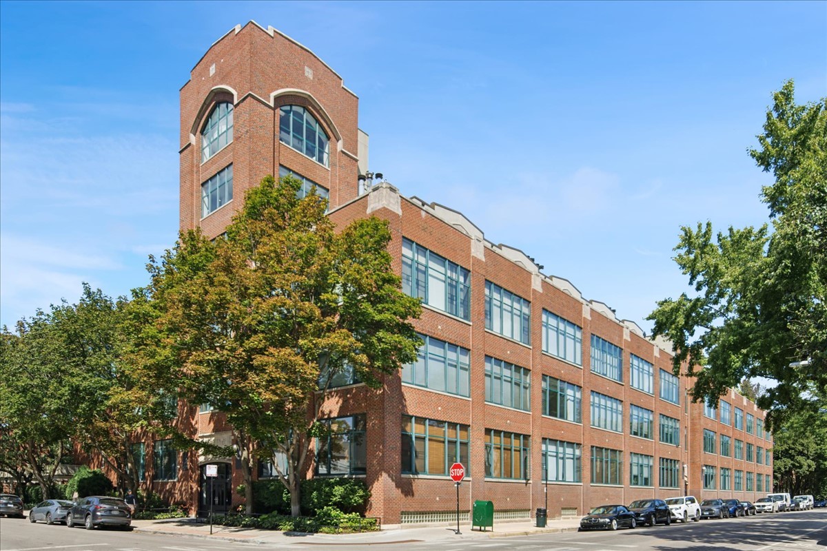 Perched atop Lincoln Park's historic Art Deco Amhurst Lofts formerly the Teletype factory, this 4-level townhouse style nearly 2,300 SF penthouse has been reimagined with extensive custom upgrades. The expansive nearly 1400SF rooftop outdoor space, professionally designed outdoor oasis by Reveal Design features pedestal-style tile flooring, an outdoor kitchen with gas grill and beverage refrigerator, a west-facing dining area, a fire-table lounge area, landscaped green space for a backyard feel, and custom designer planters-perfect for entertaining or quiet relaxation with outdoor sound system. The fabulous kitchen boasts all new appliances installed May 2025, including a micro/oven/convection combo, refrigerator, and dishwasher, with a new cooktop and downdraft in August 2025, plus updated LED wafer lighting throughout. Lugbill Design created an owners retreat with a spa-inspired primary bath with a bidet-style toilet in a private water closet, a multi-feature shower, double sinks, a bubble tub, and an adjoining workout area. Full-home enhancements include fresh paint by Lookswell, plush Turkish wool carpet from Home Carpet One, a new dual-zone mini split and 5-ton commercial HVAC unit by Guardian, remote blinds in the living, dining, kitchen, and primary suite from The Shade Store, and a stunning updated fireplace wall. Dramatic ceilings, abundant natural light, and three private outdoor spaces make this residence a rare offering in one of Chicago's most sought-after loft communities, complete with attached heated garage parking. Not your ordinary condo, welcome home to your extraordinary abode!
