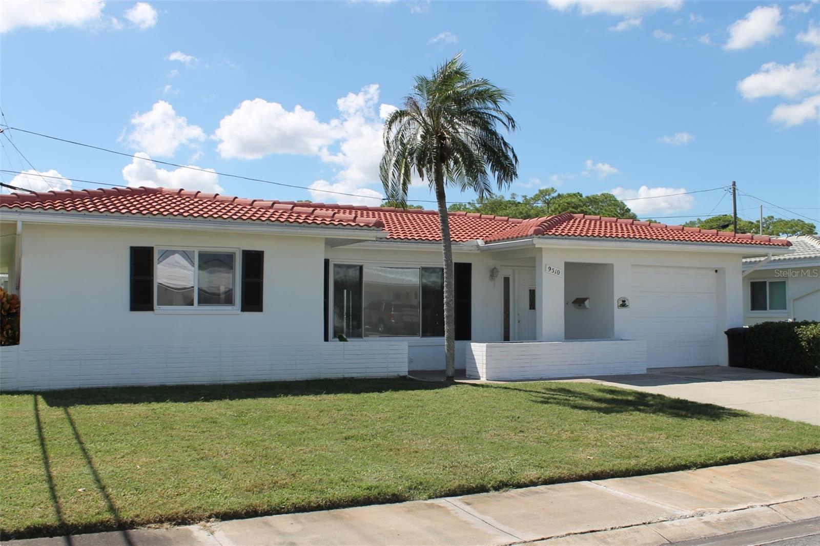 This Popular 2-Bed, 2-Bath, Eden Model, has a very spacious floorplan! Unlike many homes in the community, this property enjoys a uniquely open backyard view, with thoughtfully positioned neighboring homes creating a wonderful sense of space rather than the typical homes backing up to other homes. The lengthy Florida Room has a wall of Windows to let the light in and the backyard view. The 2 Bedrooms are Roomy with the Owner’s Bedroom having a Large Walk-In Closet and the Guest Bedroom with dual Closets. There is an eating area in the Kitchen and a Pass Thru from the Kitchen to the Florida Room. Tile & Flat Roofs were replaced in 10/2024. The Home is located in Mainlands Unit 1 which has a Clubhouse with a Heated Pool & Shuffleboard Courts. Low Maintenance Fee of $489 covers the Water; Trash; Sewer; 2 Cable Boxes; Internet; Exterior of the Home, including the Roof & Lawn Maintenance which are Maintained by the Association. Unit 1 DOES allow 2 pets with NO weight limit (dog/cat). This is a 55+, Golf Cart Friendly Community where the Mainlands Golf Course, public par 67 ‘Florida Links’ style course resides. The Mainlands is situated within the City of Pinellas Park which is centrally located, offering residents easy access to everything the Tampa Bay area has to offer. You’ll be just a short drive from world-famous Gulf beaches, shopping, restaurants, and major airports, including Tampa International and St. Pete-Clearwater. The area’s convenient proximity to Bay Area bridges makes travel throughout the region effortless.For those looking for an active adult lifestyle, Pinellas County is a dream destination. With its numerous parks, golf courses, cultural venues, and recreational activities, there is never a shortage of things to do. The thriving community atmosphere and beautiful year-round weather make Pinellas Park a highly desirable place to call home. This is the perfect opportunity to enjoy affordable, low-maintenance living in a vibrant community. Don’t miss out on the chance to make this your next Florida home!