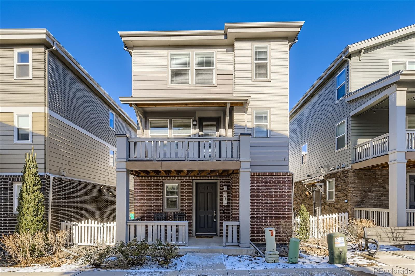 Gorgeous 3-story detached condo lives like a single family home.  Low maintenance living. This beautiful home features 3 bedrooms, 2.5 baths, living room, dining nook, kitchen, mudroom and 2 car attached garage. Pride of ownership shines throughout. Enjoy relaxing on the deck or the covered front porch.  The kitchen is well appointed with slab quartz counters & island, stainless steel appliances (gas range), tile backsplash and under cabinet lighting The many windows throughout allow the natural sunlight to cascade in - bright and cheerful. Neutral tones make it easy to picture yourself calling this one home. Easy / quick access to Cherry Creek Reservoir, shopping, dining, entertainment and other amenities such as Heather Ridge Golf course and light rail.  Ample visitor parking available. Furniture and gas grill are negotiable. Don't miss your opportunity. Welcome Home!