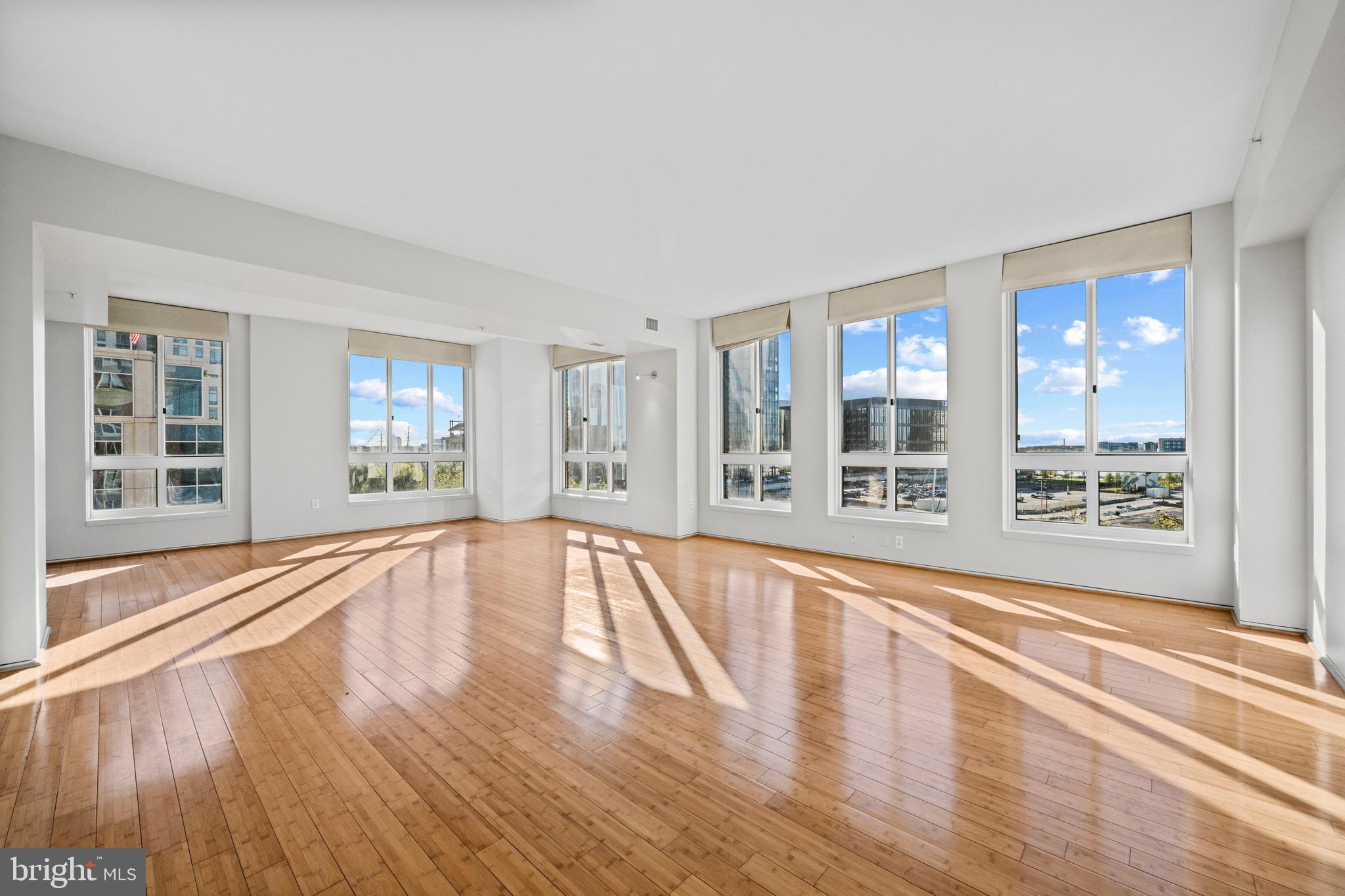 Experience  panoramic southern and eastern water views  from this stunning  corner residence at Spinnaker Bay, one of Harbor East’s premier waterfront addresses.  Designed for both elegance and comfort, this light-filled  two bedroom, plus den home, features two full and one half baths , including a spacious primary suite with dual walk-in closets.   Expansive floor to ceiling windows fill the interior with natural light from sunrise to sunset.  Enjoy the convenience of  direct same floor access to the parking garage, with two separately deeded parking spaces included in the condo fee.  Residents of Spinnaker Bay enjoy a full suite of amenities, including a rooftop pool, fitness center, and refined common areas, offering an effortless and sophisticated city lifestyle steps from Harbor East dining, shopping, and the waterfront promenade.