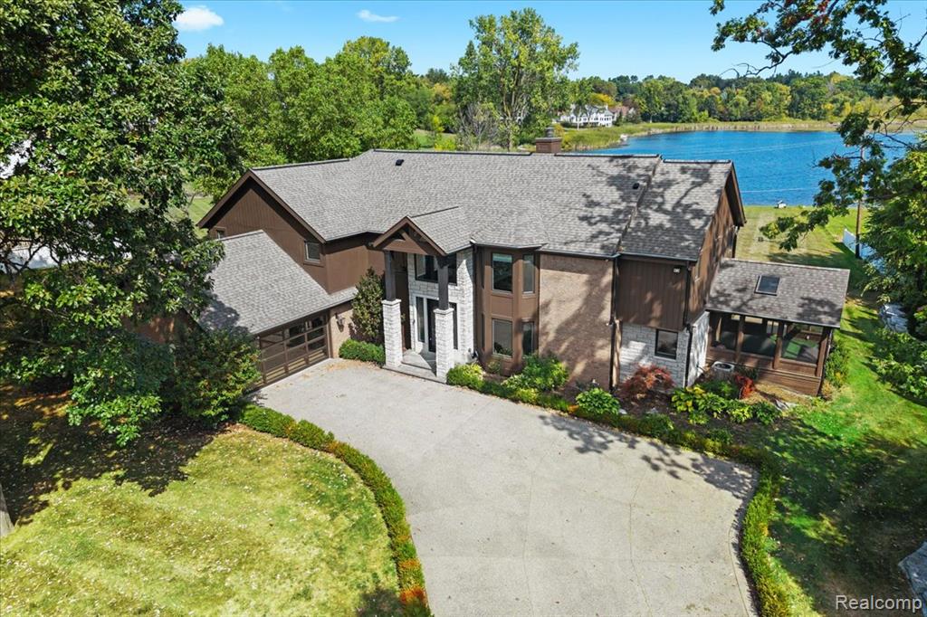 PRICE IMPROVEMENT!!!  OPEN HOUSE THURS OCT 9th 2-4PM Stunning Two-Story Contemporary Colonial Lakefront Home 
This exquisite two-story contemporary colonial: A perfect blend of timeless architecture & modern luxury, nestled on the serene lakefront-no motor Orange Lake, offering peace, privacy, & natural beauty.
Special Features:  This home was completely remodeled in 2016-2017 
Open Floor Plan: Designed for seamless living & entertaining, the expansive open-concept main floor flows effortlessly throughout, centered around a breathtaking two-story great room complimented w/ a wall of soaring windows & panoramic lake views. A two-sided gas fireplace connects the great room & dining room creating a warm, inviting ambiance.  
Expansive Chef’s Kitchen: The heart of the home features custom cabinetry, a large island, professional series appliances including Wolf range/double ovens, Subzero refrigerator, warming drawer, etc. A generously sized walk-in pantry provides ample storage & prep space for the home chef.
Dual Primary Ensuites: Enjoy the flexibility of primary ensuites on both the 1st & 2nd floors—perfect for flexible living or ultimate guest accommodations. Each ensuite is thoughtfully designed w/ spa-like baths, walk-in closets, & lakefront views. Private Sauna: a luxurious touch that enhances the home's tranquil appeal.
Lakefront Lifestyle: no-motor lake, enjoy kayaking, swimming, & quiet time on your private lakefront —no noise, just nature. 
Additional notable features-French Oak wide plank hardwood floor throughout 1st & 2nd floors, sun room, full house generator, baseboard heating offering clean heat, ideal for those w/ allergy sensitivities complemented w/ forced air, gas line for grill for your outdoor bbq, heated floor in primary baths, concrete aggregate driveway, sprinkler system sourced by lake water, 240V outlet for EV charge & additional refrigerator in garage. Annual harvest/lake fee of $500.00. Please ask about 15 ft easement at property line