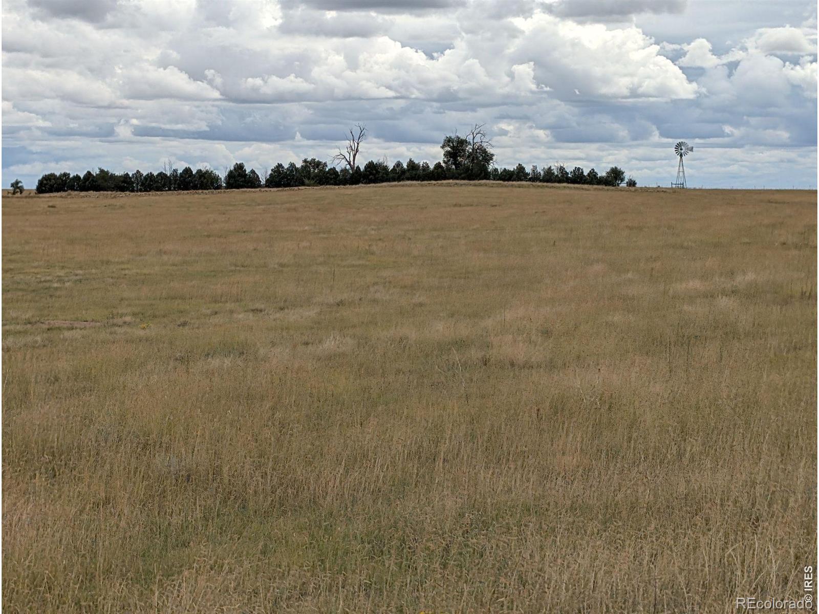 Pfost Farm & Grass Ranch near Rush, CO offers 872 deeded acres: 347.2 acres of dry farmland and 524.8 acres of grazing land. Approximately 267.78 cropland acres were recently planted to wheat. Another 74.42 acres are in CRP through 9/30/2032, paying approx. $2,314 annually. Paved Highway 94 access, existing wells and a windmill support farm use. Native grass pasture offers grazing and wildlife habitat. Potential to split land into smaller lots. 50% of Seller-owned mineral interests convey. The property brings together dryland cropland, income-producing CRP and native grass pasture, offering flexibility for farming, cattle grazing, conservation and recreation. Existing wells and a windmill provide water infrastructure for agricultural uses. Wheat was recently drilled on approximately 267.78 acres and will be ready for buyer to harvest next year. Direct access from paved Colorado State Highway 94 makes the property convenient for moving equipment and livestock. The ranch offers the privacy and wide-open character of the Eastern Plains, with distant mountain views, broad horizons and dark night skies. Colorado Springs and Limon provide shopping, agricultural suppliers and other services, while La Junta offers access to livestock sale barns. The mix of cropland, CRP and native pasture provides habitat for pronghorn, deer, upland birds and other plains wildlife, adding appeal for hunting, horseback riding and exploring the property. Offered at $872,000, or $1,000 per deeded acre, this is an opportunity for an existing farm or cattle operation, a land investor or a buyer seeking a substantial Colorado ranch. Its acreage and paved highway access may also offer potential for division into rural tracts, subject to applicable requirements and approvals. Whether added to an existing operation or held as a stand-alone investment, the property offers agricultural utility, recreational appeal and long-term flexibility
