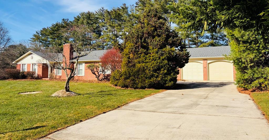 Beautiful, Spacious Brick Home in a Highly Desirable Location in Hillsville! Welcome to this stunning brick home offering over 2,500 sq. ft. of comfortable living space in one of the area's most desirable and peaceful neighborhoods. Conveniently located close to town yet tucked away in a quiet setting, this home combines comfort and charm.  Home features, 3 Bedrooms, 3 Full Bathrooms, huge open great room, living room with fireplace, dining room, beautiful kitchen with brick surrounding the cooktop and oven area. Beautiful hardwood floors throughout, updated bathrooms to include a tile shower. Downstairs is a partially finished basement with a cozy den with fireplace and an optional 4th bedroom area—perfect for guests, hobbies, or extra living space.     Major Updates Completed   New roof and gutter guards (2020)   Replacement windows   New indoor HVAC system    Spacious 2-Car Garage with Extra storage space included.  Enjoy the beautifully landscaped yard—watch deer play right from your back yard. A rare serene setting this close to Town!