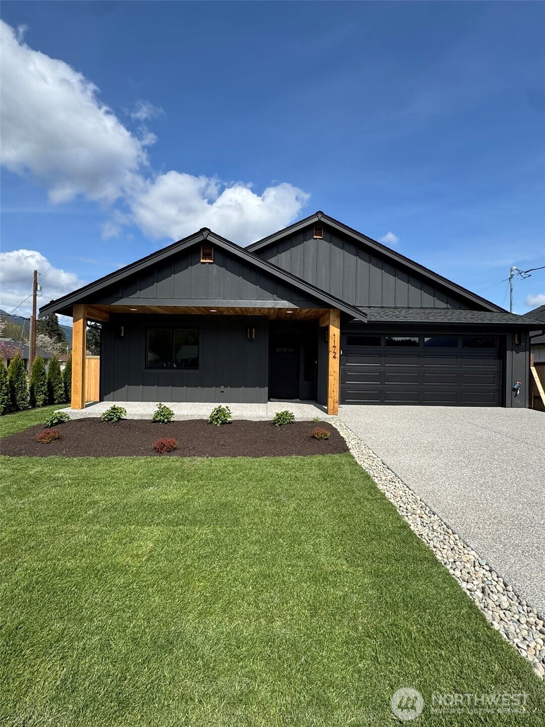 STUNNING NEW CONSTRUCTION RAMBLER - Brand New 3 bedroom, 2 bathroom home w/gorgeous mountain views in charming Darrington. Beautiful quality finishes throughout. Features include:  heat pump w/AC, quartz countertops w/tile backsplash, SS appliances, propane fireplace, primary bedroom w/ensuite bathroom & walk-in closet, open concept vaulted ceiling living room/kitchen with island/dining, flush entry, fully landscaped & fenced. So many amenities within walking distance including schools, park, library, transit, & more! You could head out your front door and be hiking, biking, swimming in the rivers, fishing, etc. by this spring/summer! Enjoy the quiet pace of country life while still being just 75 miles to Seattle via I5 & 100 miles to eastern WA via SR20. Buyer to verify all.