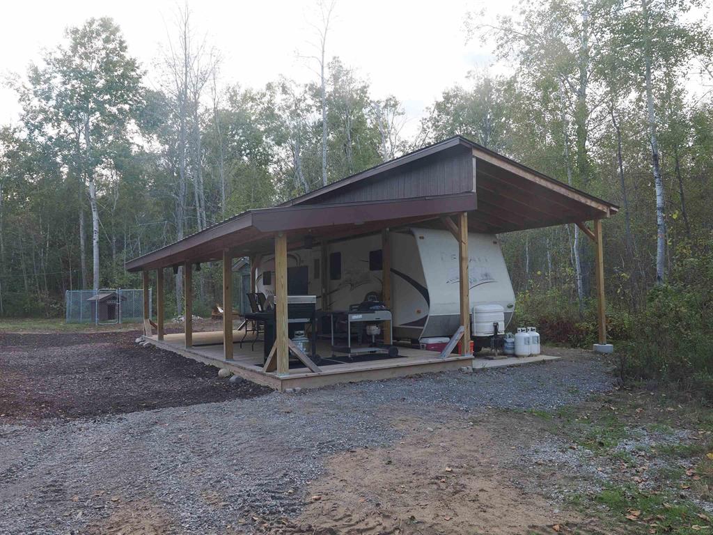 This 40 acre camp features a 2009 RV on a concrete pad with a roof over and covered porch, a nice bunk house with wood and propane heat, and a garage with a lean-to for wood storage. The 40 acres is low but dry in the NE (where the camp is) and goes up in elevation as you go SW. There are trails throughout and several well built elevated box blinds. A small stream flows through the property providing fresh clear water. The property has state land on two sides and large private acreages on the other 2 sides. This is off grid, everything is wired for a generator. No well or septic. There is a nice outhouse. There is water storage for the outhouse and the sellers bring in their own water. Everything about this camp is in excellent and well maintained condition. The property has a history of quality whitetails and there is deer sign throughout the property. The seller reports grouse and woodcock on the property but has not paid attention to populations. The seller does not hunt bear but I know there has been good bear hunting in the surrounding state land.