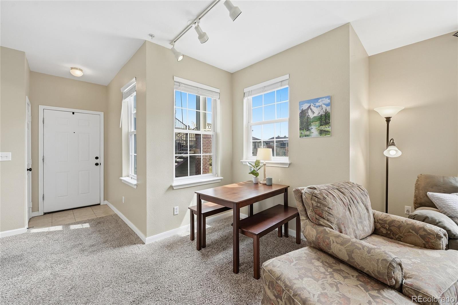 Welcome home to this charming condo in the heart of Parker.  This open floorplan features thoughtful architecture, abundant natural light all day long with southeast exposure and high ceilings.  Enjoy beautiful Colorado weather on the massive oversized deck which fits a full dining table with room to spare.  The primary bedroom is large with huge walk-in closet. Relax after a long day in the oversized soaking tub.  Have a large collection of kitchen appliances? The utility room features BONUS STORAGE with built in shelving. Participate in a lot of outdoor activities? The adjoining storage closet outside the unit easily fits seasonal clothing, golf clubs, skis or snowboards, holiday decorations, and so much more. Just minutes from dining, shopping, entertainment, Mainstreet, and grocery at Costco, Whole Foods, Sprouts, and King Soopers.  Make use of the tennis courts at Creekside Recreation Center which is just across the street. Cherry Creek Trail is just 1/2 mile away. Onsite management is during office hours. Interested in more upgrades? Ask about loan options that include purchase + upgrades. BUYERS - ensure your agent reviews showing instructions.