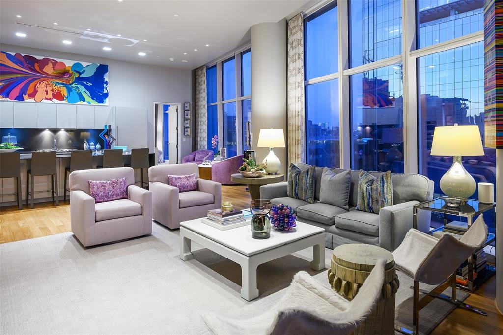 Commanding a premier position in iconic Museum Tower, this exquisitely upgraded 2-bedroom, 2-bath residence offers private direct elevator entry into an elegant foyer, setting the tone for refined high-rise living. Soaring 12-foot ceilings and dramatic floor-to-ceiling glass frame protected views of the Winspear Opera House and the architectural beauty of the Dallas Arts District. The expansive open-concept design is ideal for sophisticated entertaining, anchored by a chef’s kitchen with premium integrated appliances, custom cabinetry, and elevated designer finishes. Walls of glass capture tranquil treetop vistas by day and a stunning illuminated skyline by night. Residents enjoy white-glove services including 24-hour doorman, valet, concierge, resort-style pool, state-of-the-art fitness center, and two secured parking spaces. Steps from Klyde Warren Park, Michelin-recognized dining, and world-class cultural venues, this residence offers a rare opportunity to own within Dallas’ most prestigious address.