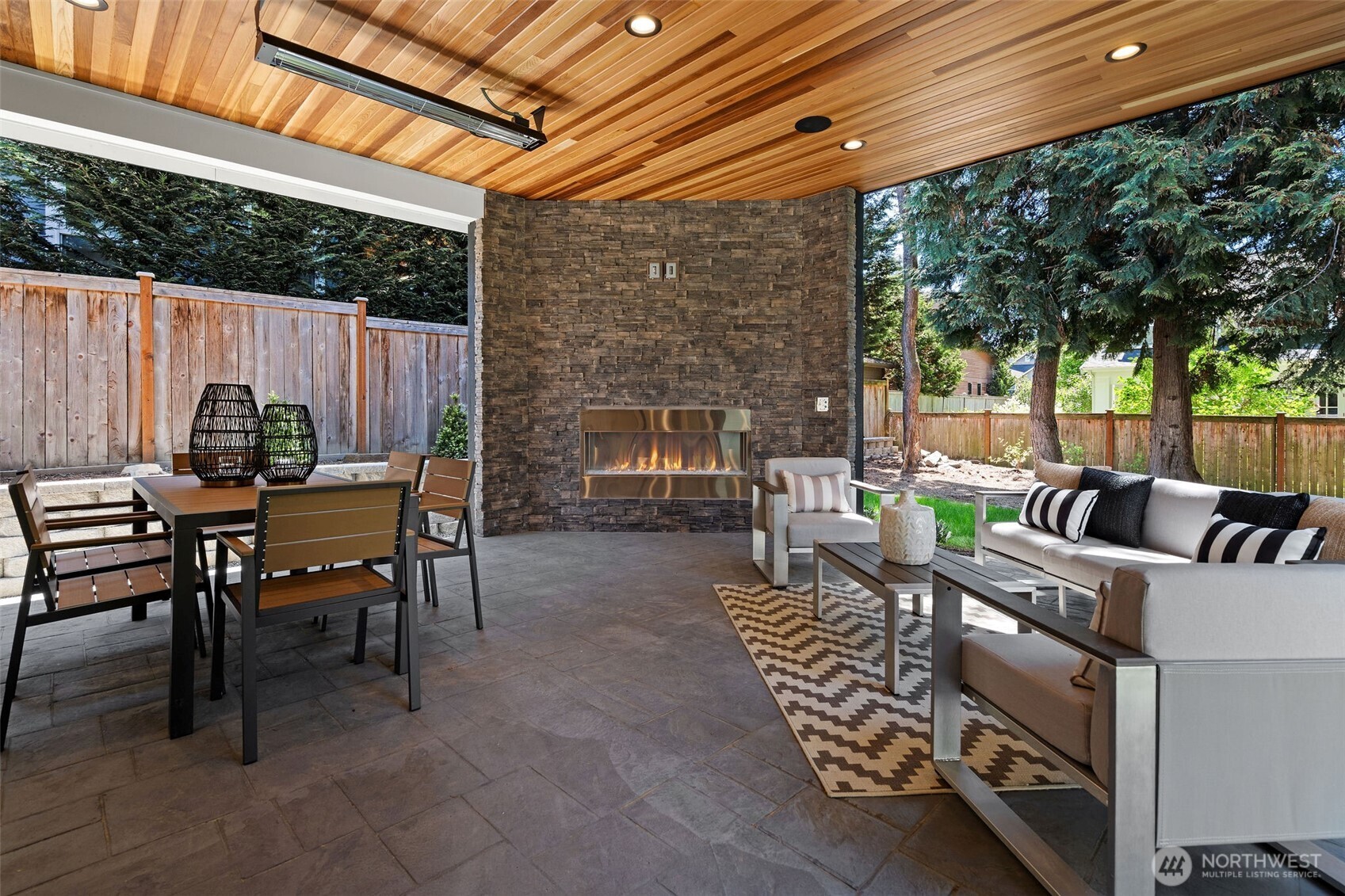 Enjoy outdoor entertaining all year round by the glowing gas fireplace.