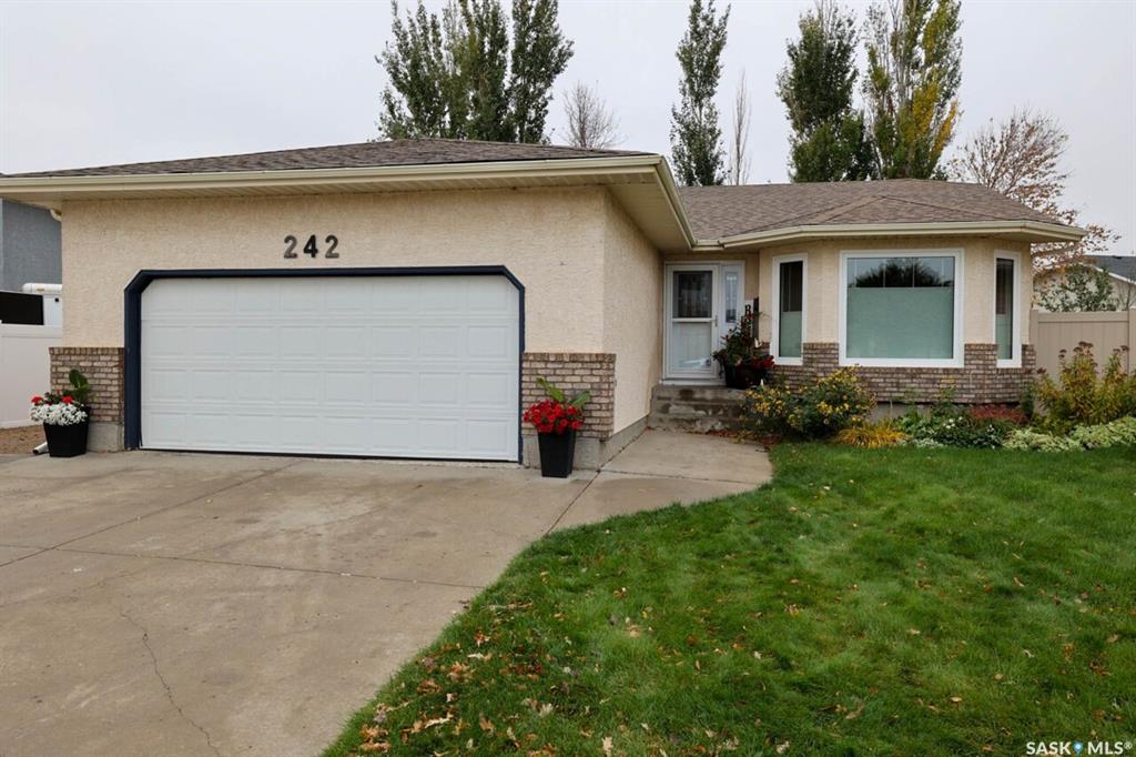 Welcome to 242 Par Place in Westhill Park!Exceptional space, an ideal location, and room for the whole family! Situated on a quiet bay near parks, walking paths, and Joanne Goulet Golf Course, this 1,624 sq. ft. bungalow offers abundant living space and incredible versatility for growing families or multi-generational living.The spacious main floor features open-concept living areas filled with natural light, creating a warm and inviting atmosphere. Perfect for entertaining, the home offers a generous family room with gas fireplace, a dining area with plenty of room for gatherings, and a large kitchen with abundant cabinetry and counter space. The adjoining eating area provides access through garden doors to the private backyard, where mature trees and shrubs create a peaceful outdoor retreat.The primary suite is a standout feature, offering an expansive layout, beautiful windows, a custom walk-in closet, and private ensuite. Two additional well-sized bedrooms with generous closet space and a four-piece main bathroom complete the main floor.The fully renovated basement adds versatility, featuring three additional bedrooms with egress windows, a full bathroom, and a massive recreation room with endless possibilities for family living, entertaining, or dedicated work and play spaces.Additional features include an insulated double attached garage, ample driveway parking, and extra parking beside the garage. Updates include new main-floor windows, custom blinds, front and rear entry doors, and garage door in 2025; a high-efficiency furnace and HRV in 2021; three basement egress windows, a new bathroom, and a full basement renovation in 2024; plus newer shingles, updated handles and locks, and PVC fencing along both sides of the yard.With generous living space, extensive updates, and a sought-after location, this home offers an outstanding opportunity to settle into Westhill Park and make it your own. Contact your REALTOR® today to book your private showing!