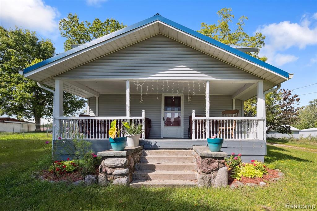 This updated farmhouse blends character with potential, featuring a circular main floor layout with family room, living room with fireplace, spacious eat-in kitchen, mudroom, and full bath with laundry. Upstairs has 4 bedrooms and a half bath. Enjoy stunning sunsets and river views from large windows and glass doors. Property includes 3 outbuildings (pole barn, steel lean-to, detached garage), plus a breezeway to an additional 2-car garage and covered storage. Outdoor highlights include mature lilacs, magnolia tree, grapevines, and a century-old trumpet vine. Watch wildlife and horses from the porch or relax at the river’s edge. Recent updates include a durable metal roof, natural gas furnace, 200-amp service, and ductwork to the 2nd floor. A well-loved farmhouse ready for your finishing touches!