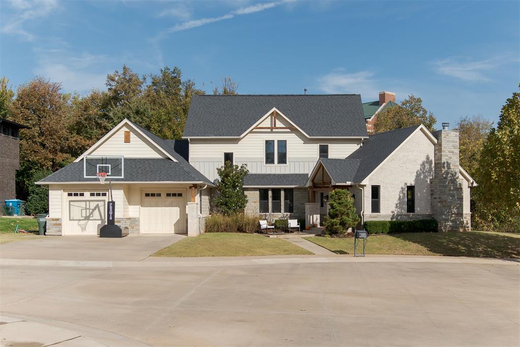 Nestled in one of Edmond’s most sought-after neighborhoods, this stunning 2,880 sq ft modern craftsman offers the perfect blend of style, comfort, and location. The home was designed by Jerry Stivers and built by Josh Moore. Tucked away in a quiet cul-de-sac and backing up to walking trails and a peaceful park, this home provides both privacy and convenience — just minutes from shopping, dining, and downtown Edmond. Step inside to find a bright, open floor plan filled with natural light from expansive windows and accented by soaring wood beams and a striking wood-burning fireplace. White oak wood flooring throughout living room and kitchen. The chef’s kitchen is designed for entertaining, featuring a 6-burner Monogram range, sub zero refrigerator, oversized island, and beautiful views of the wooded creek behind the home. The spacious primary suite is a true retreat with a spa-like soaking tub, dual vanities, and an impressive walk-in closet. Upstairs, you’ll find two generously sized bedrooms, each with its own private bath, plus a secured storage room. A large walkout attic offers potential for a second living area, home office, or additional bedroom. Tankless hot water heater. Enjoy outdoor living year-round on the expansive back patio complete with a cozy fireplace — perfect for relaxing or hosting friends. Located in the heart of Edmond, this home combines natural beauty, craftsmanship, and convenience in an unbeatable setting. Freshly painted baseboards and some of the woodwork throughout!