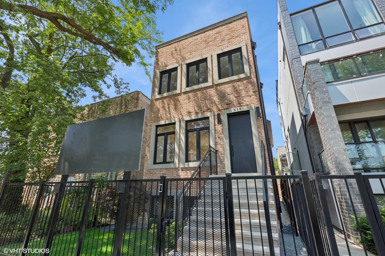 Stunning new construction home spans 4000 square feet across three levels. Situated on a quiet one way street in desirable West Town, this residence offers 5 bedrooms + den/office, 3.1 bathrooms, spacious rooftop with doghouse, a 2 car masonry garage with roofdeck and outdoor fireplace, and a professionally landscaped yard.    The interior boasts oversized windows, quartz countertops, designer plumbing and lighting fixtures, wide-plank white oak floors, LED lighting, two interior fireplaces, wood paneling accents, and much more. The kitchen is equipped with a top-of-the-line Monogram appliance package. Upstairs features 4 bedrooms / 2 bathrooms plus full laundry room. The lower level offers a full wet bar, heated floors, a large recreation room, one additional bedroom and den/office.    Close proximity to public transportation, I-290, neighborhood shopping & dining, Medical District and much more. Mitchell School District.