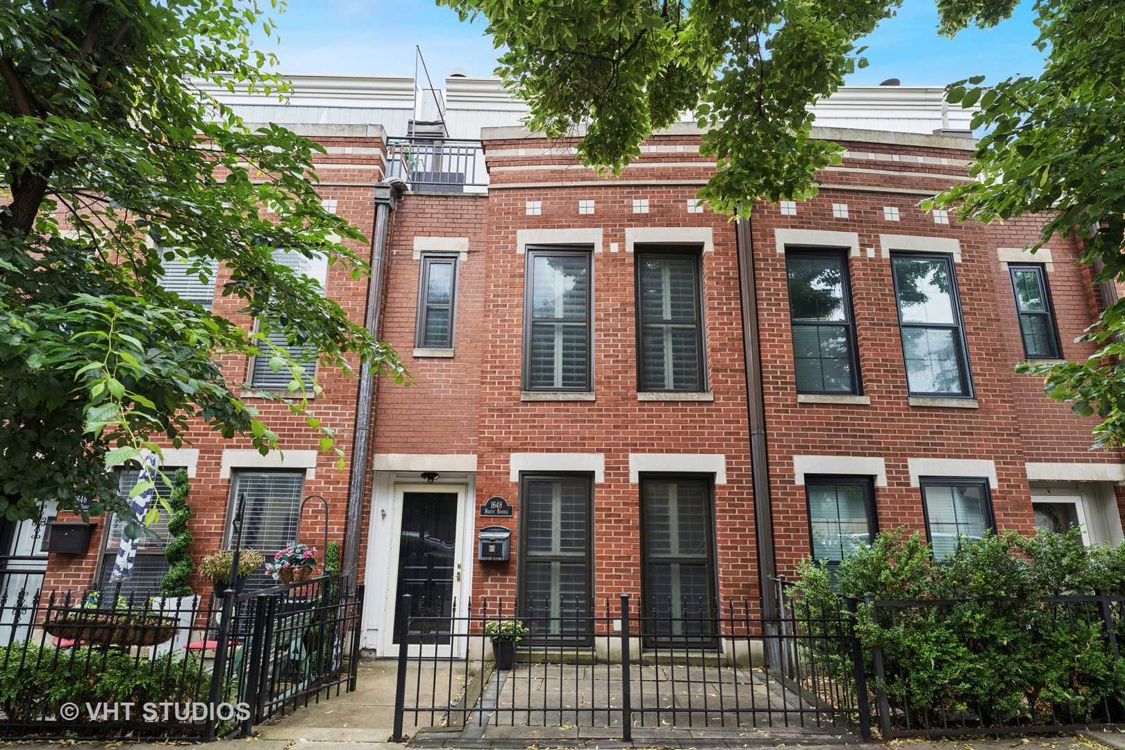 Lincoln Park's best-kept secret! This rare fee-simple Willow Rowhome offers the space and feel of a single-family home-at a condo price-with no HOA! Perfectly tucked away on a quiet, tree-lined street just steps from Armitage Avenue restaurants and boutiques and the Clybourn Corridor's Apple Store, Whole Foods, and Red Line.    Beautifully updated and move-in ready, this charming tri-level home features three sun-filled floors, two private outdoor spaces, and a heated attached 1.5-car garage with two large storage closets. The curb appeal is undeniable with its all-brick exterior, newer hardscaping, windows and custom fencing, and timeless white plantation shutters.    Inside, no detail was spared (see the full list of improvements under "additional information"). The designer kitchen is a standout with seamless black honed granite counters and classic farmhouse sink. Other highlights include: rich walnut hardwood flooring throughout // wood-burning fireplace with built-in bookcases // custom millwork and moulding // renovated primary bath // and marble guest bath with walk-in shower.    The entire top floor is an expansive primary suite oasis complete with a walk-in closet, LG washer/dryer, luxurious en suite bath with skylight and designer lighting, and a serene private terrace nestled among the treetops.    All this just steps from Starbucks, Trader Joe's, Jayson Home, CB2, Alinea, Steppenwolf Theater, and both Red and Brown Line trains.    Truly a hidden gem in the heart of Lincoln Park. WELCOME HOME.