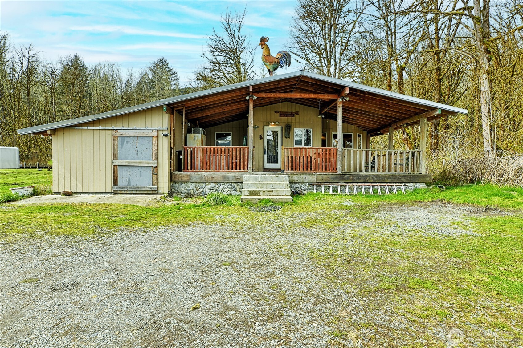 Comfortable, private home on 10+ acres nestled against over 50 mi.² of national Forest and a creek. Space for riding hiking and hunting. Fenced and cross fenced. Flat pastures. 5 miles to town walking distance to casino, dining,store and rec center in progress. 2 rustic barns, tool shed, 2 RV spaces with 30 and 50 amp power. 1 is enclosed and paved with a mechanic pit. 1 is uncovered with full hook ups and laundry building. Additional covered parking/storage. RV rental income potential. Layout provides possible second family room. Granite in kitchen, tile bathrooms, laundry, and foyer. Large rain shower. Appliances less than one year old. Covered porch to sit and admire the beautiful Mountain View.