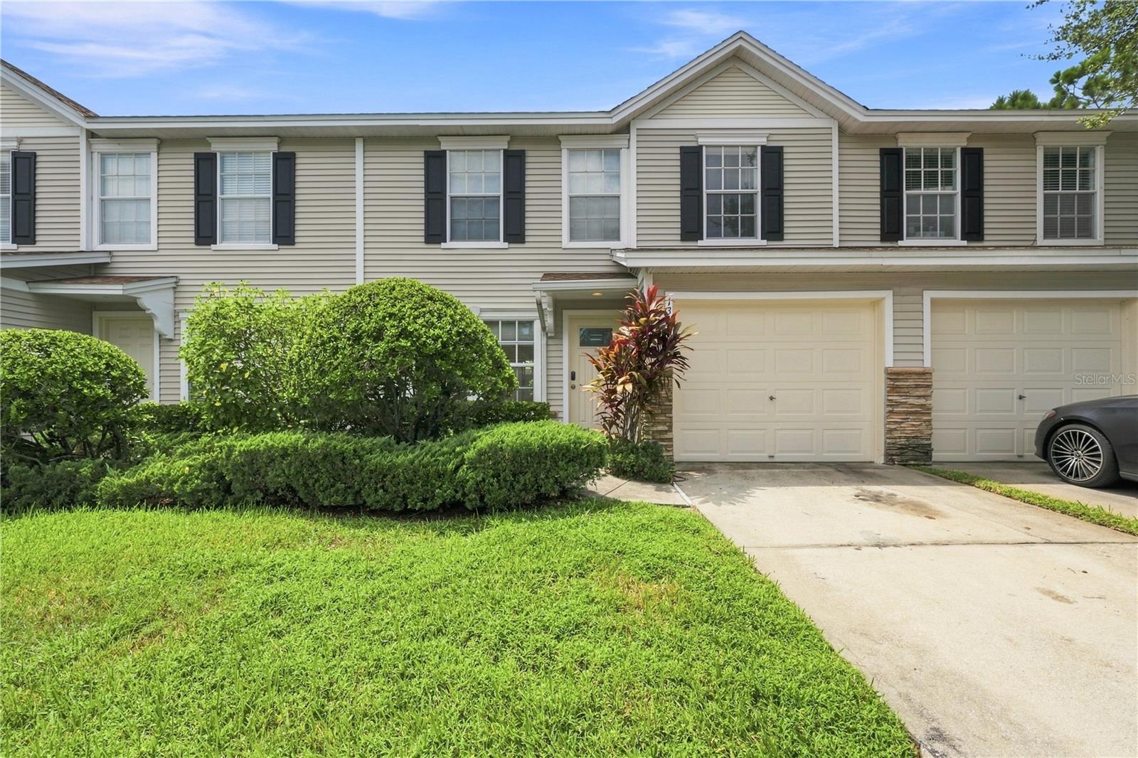 WOW .....  Charming move in ready 2 Bedroom  1.5 Bath PLUS a Loft and 1 Car GARAGE Townhome in highly desirable community of Cumberland Trace! Maintained with love, the home offers an open and inviting floorplan perfect for all types of entertaining. Or just chilling out watching your favorite movie. From the moment you open the front door, you know you are home. Woodlike plank flooring thru-out. Oversized windows provide just the right natural light. Generously sized dining area offers sliders that open to a cozy and private patio perfect for enjoying your morning coffee. The spacious kitchen offers stainless appliances, granite counters, breakfast bar, abundance of cabinet space. Convenient 1/2 bath perfect for your guests. Easy access to your attached garage, perfect for carrying your shopping bags in. You will be pleasantly surprised when you travel upstairs. You will find a spacious primary suite large enough for all of your furniture and with volume ceilings. It includes an oversize walk-in closet with shelving and plenty of storage. The primary ensuite bathroom boasts double sinks, a separate garden soaking tub plus a walk-in glass shower! The bathroom can be accessed from the primary bedroom or the hallway. The bedroom layout is the desirable SPLIT PLAN that offers maximum privacy. The second bedroom is spacious, has large windows providing natural light, volume ceilings and a large wall to wall closet. And, don't forget the loft....! The loft area is bright and cheery and could be used as a great office, craft room, play room, or work out room. You decide...! Conveniently located upstairs is the laundry closet making doing the laundry chore with ease.   This townhome is steps away from the community pool. Just bring your towel. The best feature is the LOW HOA FEES -$175...! The LOW HOA Fee covers the roof, pool, grounds maintenance, and building exterior. This community is in a NON-FLOOD zone.  Cumberland Trace is conveniently located and provides easy access to numerous dining options, shopping, banking, Largo Mall, Clearwater, St Petersburg, the Gulf Beaches, I-275, and the Airport. Cumberland Trace is also a PET FRIENDLY COMMUNITY so bring your four-legged friends. Schedule your personal showing today or a Facetime Realtime Showing.