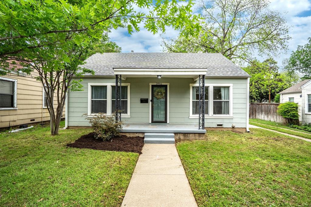 Welcome home! Nestled in Fort Worth, this charming home greets you with an adorable front porch, perfect for morning coffee or relaxing evenings. Step inside to discover a spacious living area centered around a warm, inviting fireplace, creating the ideal space for gathering and unwinding. The bright, clean white kitchen offers a fresh and timeless feel, seamlessly flowing into a dining area complete with built-in cabinets and shelves for added character and storage. Just off the kitchen, a versatile bonus room provides the perfect space for a second dining area, formal sitting room, or flex space to suit your needs. An expanded closet adds extra storage and conveniently accommodates a stacked washer and dryer. The primary bedroom is filled with natural light, creating a light and airy retreat, and features an expanded closet for enhanced functionality. A secondary bedroom and full bathroom offer comfort and convenience for guests or loved ones. Step outside to a private backyard oasis, shaded by mature trees and designed for relaxation. Enjoy outdoor living on the deck area, perfect for entertaining or simply enjoying the peaceful surroundings.