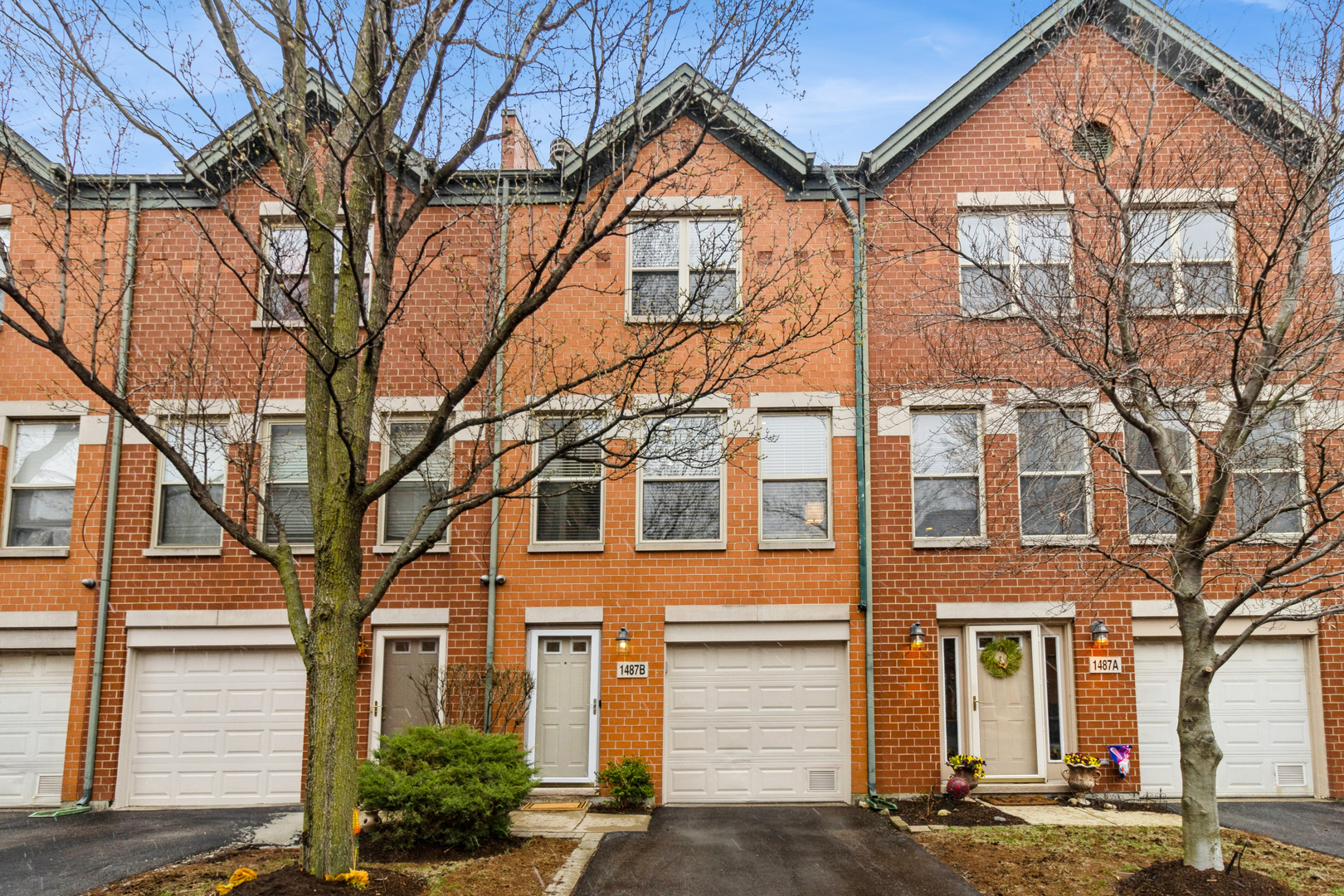 Welcome to your dream home in the heart of the city! This beautifully appointed 3-bedroom, 3-bath townhome offers the perfect blend comfort, and convenience-tucked within a sought-after gated community between Old Town and Lincoln Park.   Step into a welcoming foyer with direct access to the attached garage and a spacious bedroom with a full bath, generous closet space, and sliding doors that open to your private patio-ideal for guests, a home office, or quiet relaxation.   Upstairs, the open-concept living area is an entertainer's dream, featuring hardwood floors, custom built-ins, and a gas fireplace. The stylish eat-in kitchen is outfitted with granite countertops, stainless steel appliances, a deep sink, subway tile backsplash, and access to a private balcony-perfect for morning coffee or evening drinks.  The top floor features two generously sized bedrooms and two full baths, including a primary suite with en-suite bath and hardwood floors throughout.   Enjoy the ease of an attached garage, an additional outdoor parking space, and plenty of guest parking. All this just steps from Mariano's, Whole Foods, New City's shopping and dining, the Red Line, the Apple Store, 8 minutes drive to the beach, and more. Live in one of its most vibrant and walkable neighborhoods. No rental restrictions- All serious offers will be considered.