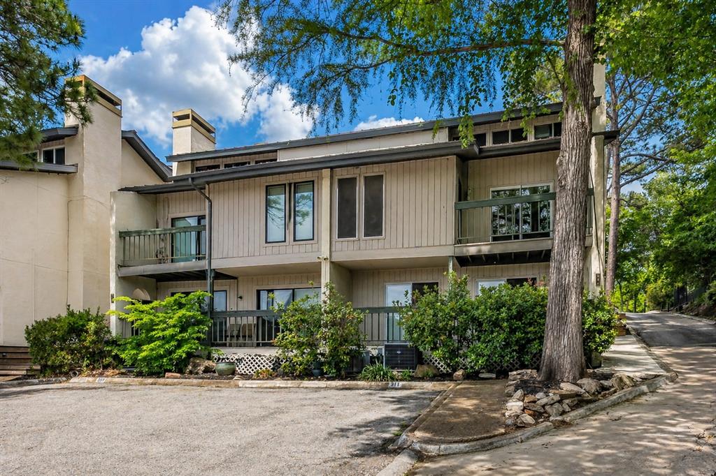 Rare opportunity to lease one of the few 3-bedroom condos on Eagle Mountain Lake, located on a quiet peninsula next to the Fort Worth Boat Club.    Enjoy lake views, abundant natural light, and a low-maintenance lifestyle just steps from the water.  The open living area features vaulted ceilings, a wood-burning fireplace, luxury vinyl plank flooring, and a private balcony perfect for relaxing. The functional kitchen opens to the main living space, making it great for everyday living or entertaining. Downstairs, both bedrooms feature private en-suite bathrooms, including a spacious primary suite with peaceful lake views. A laundry area, additional storage, and a convenient half bath complete the home. Community amenities include a boat dock, fishing dock, swimming area, and waterfront picnic spaces. HOA-covered utilities and exterior maintenance make lake living simple and convenient. If you've been looking for an affordable way to enjoy life on Eagle Mountain Lake, this is one you won't want to miss.  Available for immediate move in.