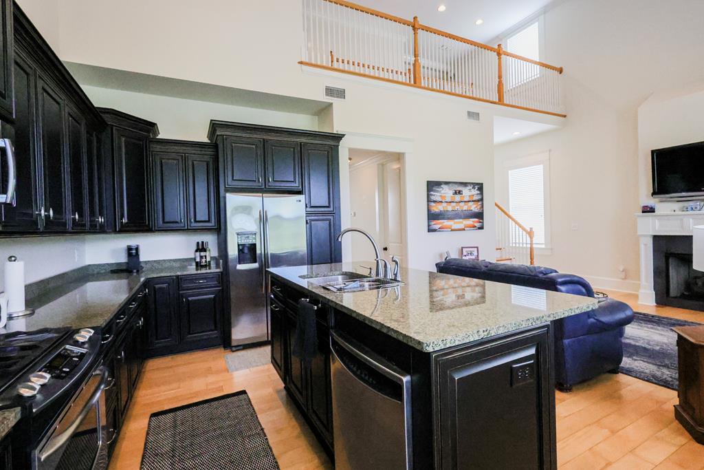 Just listed in the desirable Madison Grove subdivision. Inside, you'll find clean lines, high ceilings, and a light-filled layout made for modern living.  The open-concept main floor includes a gourmet kitchen with an abundance of cabinetry and spacious island with bar seating.  A guest bath and separate laundry room is included on the same floor for your convenience.  Upstairs, there is a second ensuite bedroom, bonus flex room or office along with a loft space for storage.  This unit is steps away from the Clubhouse where you will find a pool & a gym.  This 2 bedrooms/2.5 bath unit is convenient to just about everything in Thomasville - want the full tour?  Feel free to call to make an appointment for your private showing.