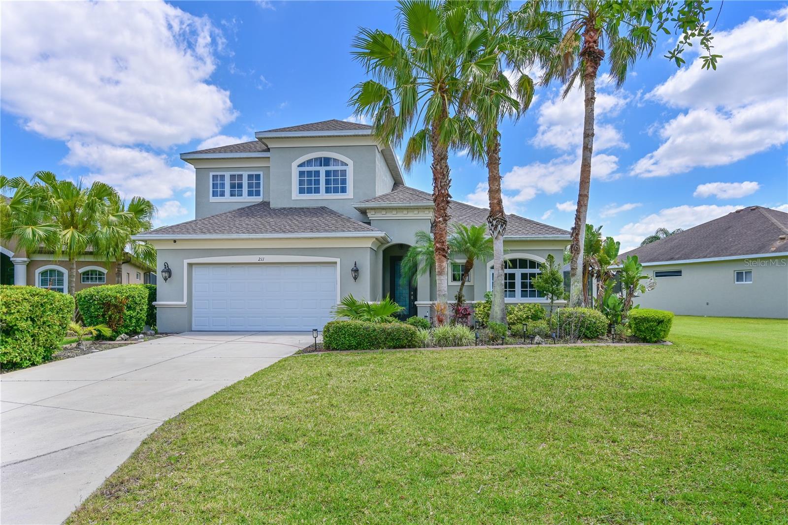 BEAUTIFUL HOME WITH AN OUTSTANDING PRICE -  consider $90,000 in upgrades/updates (2024 roof, 2024/2025 a/c units, new engineered wood flooring up and down stairs, extended paver lanai) - You can't deny the incredible pricing on this over-sized 5 bedroom, 3 bath, updated Greyhawk Landing home. BRAND NEW AC 8/2025 ($9K COST) Absolutely beautiful home, master bedroom and two additional bedrooms located on ground floor, two additional bedrooms, a full bath and a bonus loft area located on the second floor. A perfect set up for teenagers, visiting guests or in-law situation.  Room for everyone to spread out for privacy.  Fully fenced yard for your furry residents, children and privacy. Large kitchen with breakfast bar and dining area, formal living and dining rooms, super spacious family room. Large paver brick patio out back for relaxing and entertaining. Greyhawk Landing is a super neighborhood - mature trees and landscaping (not naked new construction - blah), soccer field, baseball field, bike/walking paths, two community centers with pools and tennis...gated entrance. NEW ROOF IN 2024! New engineered hardwood flooring which is children and animal friendly. One newer a/c (2024). Close to many amenities including Culver's, right out the front gate, Publix, restaurants and just minutes to I-75 and Costco and more.  This is a fabulously priced home, with $90,000 in upgrades is ready to go!