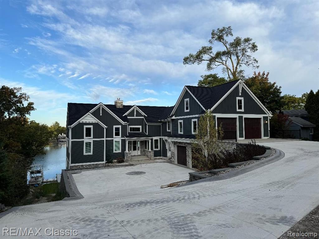 Lakefront on White Lake main Lake with incredible sunset views. The New build possibilities to build with Stone Hollow are all in your vision & we can bring them to life. We can help you design build the home of your dreams from scratch or choose from an array of plans we already have built & tweak them to fit your needs & wants. 
From Modern Farmhouse, Craftsman style or Contemporary we have built them all, with over 100
 5 star Google reviews and a spotlight on Channel 7 Home Pros you've surely connected with the right builder to make all your dreams of Lakefront living come true. The pictures on the listing are from a previous home we built on Lobdell lake in Linden with the same style lot. This lot has a magnificent Western exposure for the most beautiful sunsets. Imagine sitting on your terrace for morning coffee or entertaining on the patio or in the yard watching the fireworks right out front of your home. Boating, swimming, fishing, kayaking, ice skating, snowmobiling, bon fires & cookouts on your own lakefront oasis. Take your boat to Dinner at the White Lake Inn or enjoy the band on the deck for cocktails. Whatever you choose your sure to enjoy your year round retreat. Don't hesitate, this opportunity doesn't come around very often and they aren't making any more Lakefront lots on White Lake. Survey & Perc test already completed. We just need to design the plan of your desires and we can start building. Model available to walk through to see the quality of the build. See 3D tour attached of a previously built Stone Hollow home. You can also watch the Home Pros show on Channel 7 that was filmed in one of their homes on your favorite streaming app. 
(Design build custom home, this is not the exact home but can be similar on the lake) AZD Design can make your dreams come true with a contemporary design.
GPS 2544 Ridge to find the lot