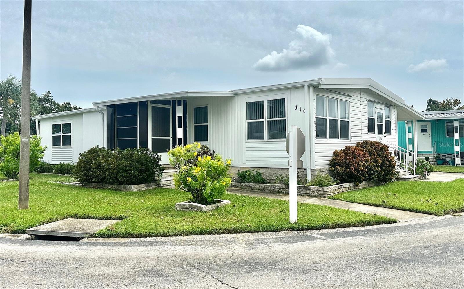 Impressive 1290 sq. ft. 2 or 3 bedroom, 2 bath Decorator Home, with 2 Florida Rooms to enjoy! Beautiful Corner Landscaped Lot, right across from the Clubhouse & 2 Pools! Inviting large front loaded kitchen, with updated designer cabinets! Newer Windows, New Insulated Roof Over with new gutters, and Central Air/Heat 5/24. Convenient inside Washer/Dryer, with wonderful storage & extra walk in closets! All updated interior paneled doors, New Exterior paint, Vinyl Siding & Fantastic 11x15 Workshop/Shed! So much to see! Come see this 5 Star, 55+, Fun & Active Resident Owned Clearwater Cascade Community! See www.Clearwatercascade website for park pics! Located next to grocery, public transportation, restaurants, and only minutes to the beaches, golf courses, airports, restaurants, malls, VA Medical, and all you need! Cash only! Asking $159,900., includes the $55k share! $330. mo. maintenance fee! Small pet ok!