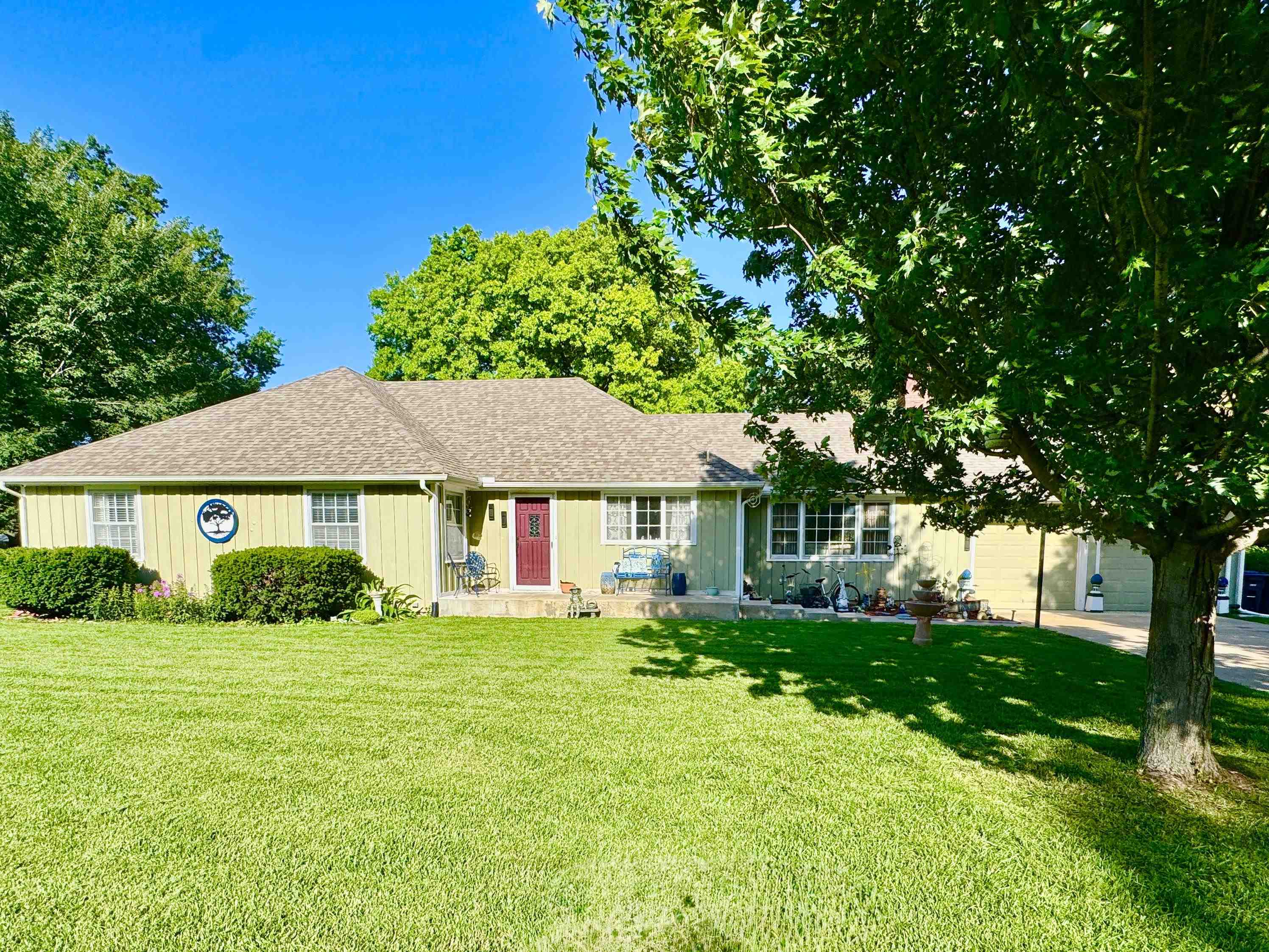 Get excited to see this spacious ranch style home! Outside you will notice the 2 car garage, sodded front yard, and front porch that can easily be adapted to a ramp. The big back yard is fenced with a nice storage shed, big open deck, and a large covered deck with a sweet hot tub. The lot is almost 1/2 acre with a sprinkler system on separate meter. Come inside to 4 Large bedrooms, 2 full baths, big living, dining and family rooms, a BIG kitchen, laundry room and more - all on the main level!!! The living room, kitchen, family room, and hallways have beautiful hardwood floors, lots of windows, & stunning light fixtures. This BIG kitchen features tons of cabinets, drawers, and butcher block counter tops.There's a pantry, eating bar, stainless steel range, dishwasher, microwave, and hood, too. The family room has a gas fireplace with a customized TV area above mantel. The recently renovated bathrooms may be your favorite thing - they are beautiful! There's Zero Entry tiled showers, rain shower heads with hand held hoses, combo vent/lights and tiled floors in both. The front bath has custom built cabinets, double sinks, lighted mirrors, lovely lighted ceiling fan, pocket door and is completely handicapped accessible! There is another bedroom in the basement, more storage and even a second laundry room with a sink. Comfort is maintained by a high efficency HVAC unit (October 2019), a.whole house attic fan, 18" of insulation in the attic and a separate HVAC unit (Furnace December 2020 ) for the basement and rear of the home. Home warranty from Choice Home Warranty will be provided with a full price contract. Come see this great home and make it your own! You don't want to miss this one!!