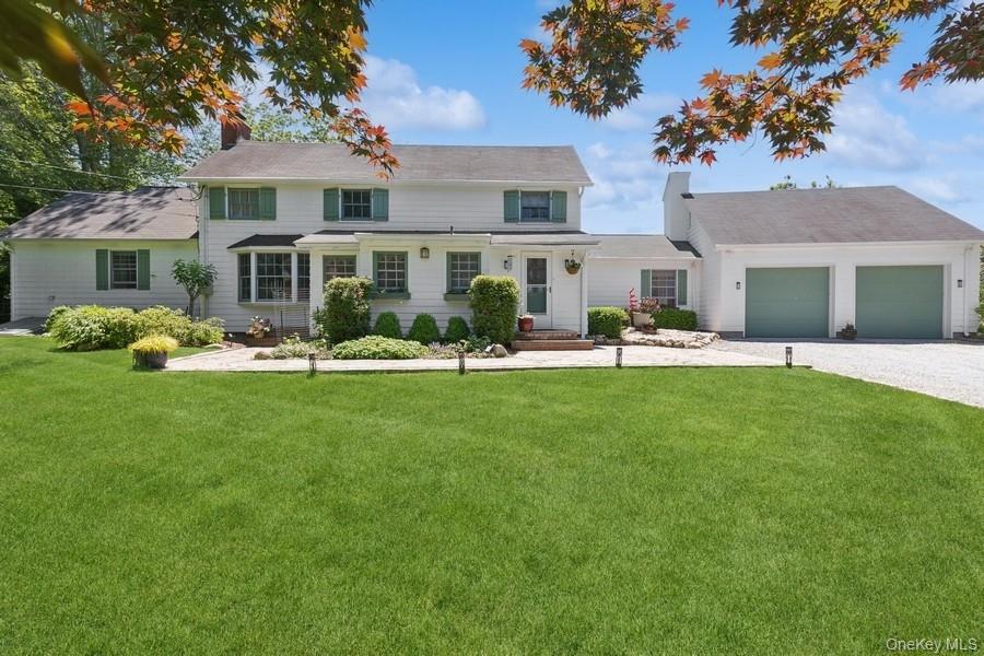 Nestled in a storybook setting where history, nature, and charm converge in this enchanting carriage house overlooking the serene waters of Mill Pond in Wading River. Steeped in character, this home is more than just a residence. Perched proudly on Hill Street, this one-of-a-kind home offers breathtaking views of the pond and the soothing sounds of nature. 
Inside, light pours in from every angle, illuminating the soul of the home. The warm, inviting layout includes 4 bedrooms, with a first-floor primary suite offering ease and privacy, and 2.5 thoughtfully updated baths. Every room is infused with charm—vaulted ceilings, wide plank floors, handcrafted woodwork, two fireplaces, and architectural details that speak to its past while offering all the comforts of the present.
This is a home that welcomes you to slow down. To gather. To dream.
Whether you’re curling up with a book in a sun-drenched nook, entertaining guests in the light-filled living spaces, or simply soaking in the peaceful magic of Mill Pond from your backyard, this home is designed to feed your soul.
Ready to write your next chapter in a home with heart and heritage?
Close to all that the North Fork has to offer, come see what makes this Wading River treasure truly unforgettable.