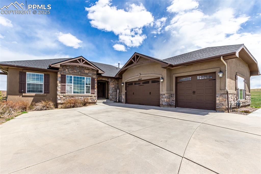 The prestigious Kings Deer community in Monument is home to this exceptional property sitting on a spacious 2.51-acre lot. This beautiful home has 5 bedrooms and 3 bathrooms. The living room has vaulted ceilings opening the space even more. Truly an open concept home. The kitchen has sleek granite counters, custom wood cabinetry with crown molding, a tile backsplash, recessed lighting, a nice size pantry, stainless steel appliances, an island with a breakfast bar and an eat in kitchen space. The  basement was  thoughtfully designed to include a family room, a versatile bonus room, a dedicated office, 2 bedrooms, and a full bathroom. Outside is a fantastic deck with beautiful views. The backyard has a paver patio, a basketball hoop, and a play area. This home is a stunner! There are so many notable thing about this house, a few of the stand out items are: Brand New Roof, Separate HVAC units for main floor and basement, Large Oversized 3 car garage, Central Vacuum System, Brand new flooring in the basement and 220 outlet in the garage. (great if you have an electric vehicle)