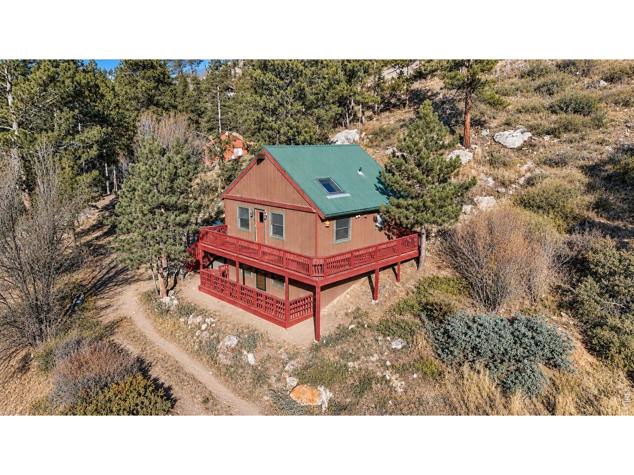 Enjoy peaceful mountain living at 280 Streamside Drive, a charming cabin set on 2+ acres near National Forest access. This 2-bedroom home with a loft offers 2 full baths, warm wood ceilings, and a wood-burning fireplace that gives the main living area a true Colorado cabin feel.The recently refinished wraparound deck and lower-level deck create inviting outdoor spaces for relaxing, entertaining, or watching the local wildlife wander through. A metal roof, newer washer and dryer, private well, septic system, and storage shed add practical value and everyday convenience.With its mountain setting, functional layout, and access to outdoor recreation, this property offers a great opportunity for full-time living, a weekend retreat.