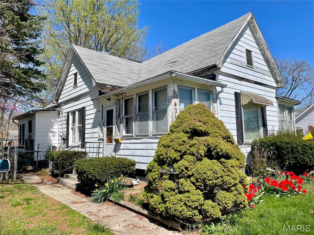 Renovation Opportunity with Classic Charm! This 2 bedroom, 1 bath home is full of potential and ready for your personal touch. Original millwork adds timeless character throughout. The spacious living room could easily be converted into a third bedroom to suit your needs. The formal dining room is currently used as a sitting area, offering flexible living space. A gas stove is included. Sold As-Is, this property is perfect for investors or buyers looking to customize their dream home.
