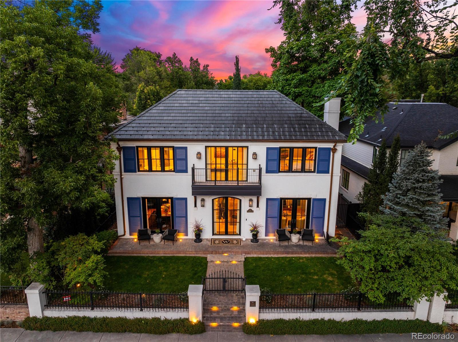 Commanding an unrivaled location directly on Washington Park, this extraordinary residence defines premier luxury living on one of Denver’s most coveted blocks. Meticulously remodeled in 2022, the home spans 5,904 square feet of refined interiors, where every detail has been curated with sophistication and style.

Exquisite finishes abound — from designer lighting and bespoke millwork to the enduring elegance of a Ludowici clay tile roof with a 75 year warranty. The chef’s kitchen is a showpiece, outfitted with Wolf appliances and crafted for both culinary artistry and effortless entertaining.

The primary suite is a true retreat, featuring sweeping park views, a private terrace, and a custom walk-in closet - grand in appearance and complete with all storage necessities. Beyond, the backyard unfolds as an entertainer’s paradise, complete with a sauna, cold plunge, pergola, and lush landscaping that create a spa-like sanctuary.

Additional highlights include an elevator, fitness studio, wet bar, and a rare three-car garage — all thoughtfully integrated to elevate daily living.

Opportunities to own a residence of this caliber, in this iconic location, are exceedingly rare. Welcome to 932 S Franklin Street — where timeless craftsmanship meets unmatched Wash Park living.