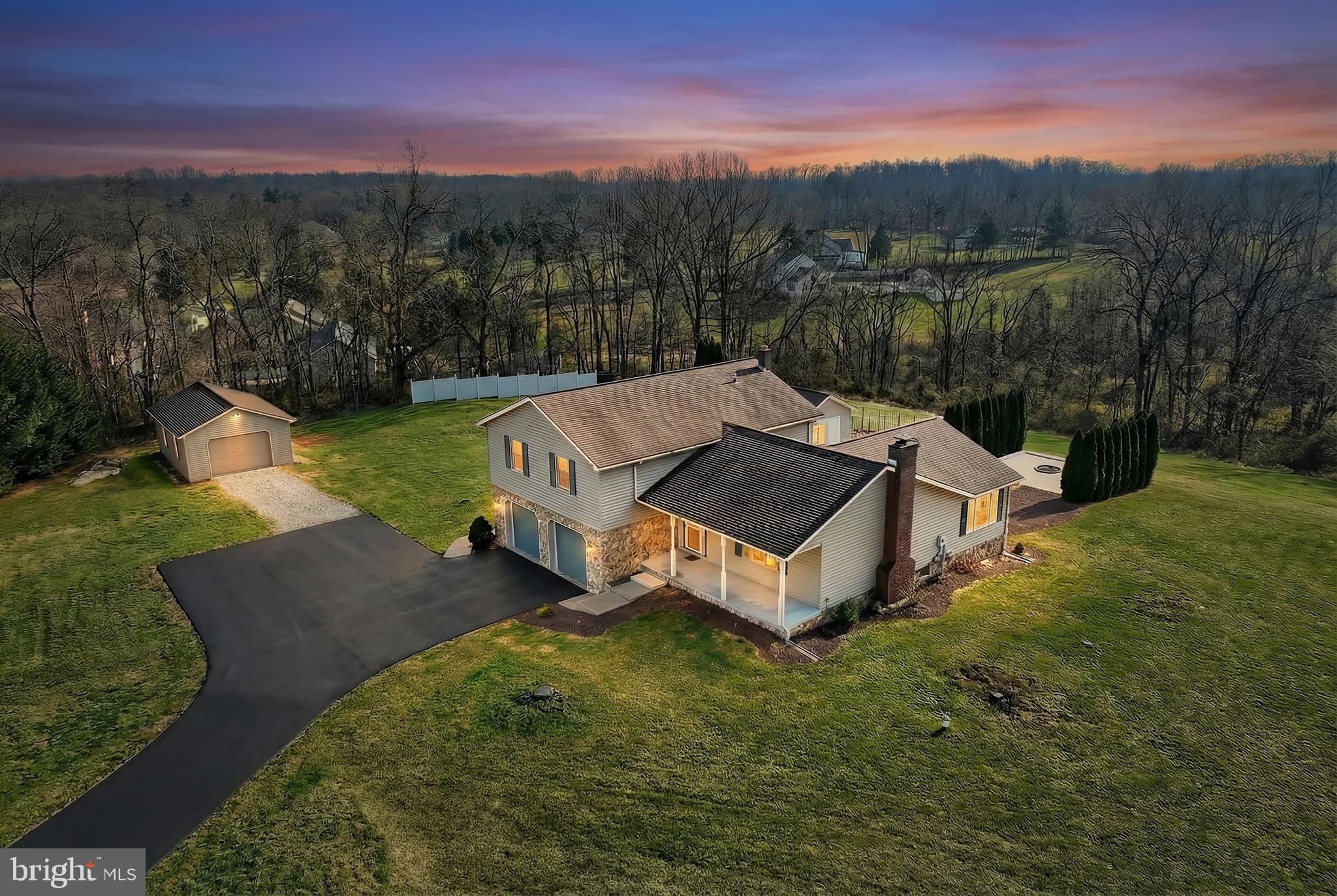 Fabulous Split Level home on just under 2 acres surrounded by trees on a quiet cul-de-sac with 2 additional detached garages and gorgeous finished lower level with brick fireplace! This home really packs a punch for under $400k! Currently 3 bedrooms with the 4th bedroom currently used as a large closet and laundry area, easily converted to 12x9 bedroom, and 2.5 baths. First floor includes cozy living room, dining room, powder room, kitchen with all appliances and huge sun room or first floor family room. Lower level recently remodeled with new LVP, fresh paint, recessed lighting and white washed brick wood burning fireplace. The upper level consists of a primary suite with new LVP flooring, walk in closet, full bath and slider to private deck. The remaining 3 rooms are all good sized and share a full bath off the hall. The covered front porch, rear patio, rear deck and large detached patio with built-in fire pit give you plenty of options for rest, relaxation or entertaining. The almost 2 acre yard is private and the attached oversized 2-car garage, and both single detached garages give you plenty of room for storage or to spread out those weekend projects. The home is situated just a short drive to all major highways and nestled on a quiet cul-de-sac with no traffic. Priced to sell, this home is the best value out there in popular Northeastern schools!