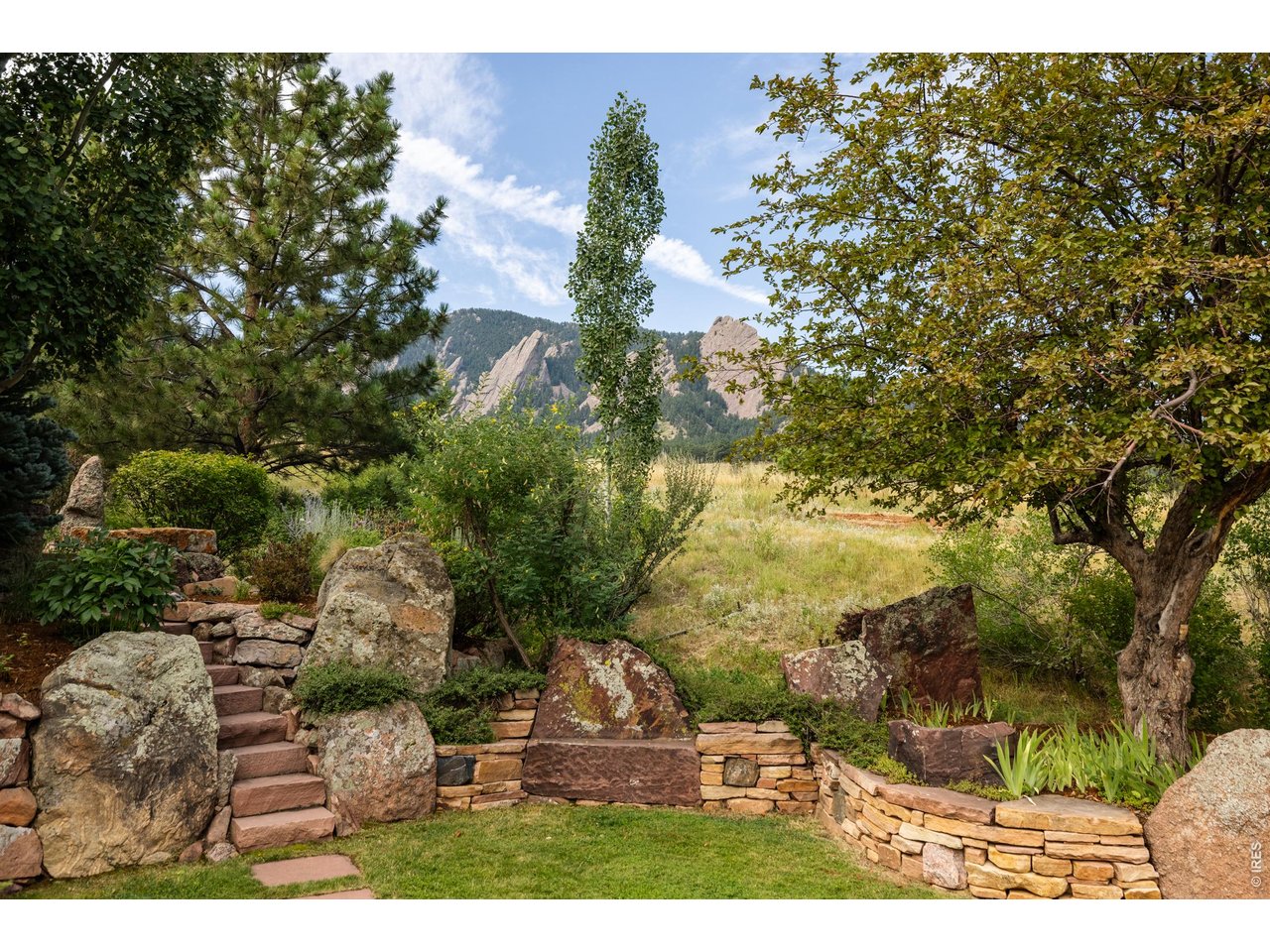 A NEW VALUE PROPOSITION: TWO RESIDENCES. ONE IRREPLACEABLE BOULDER ESTATE. Now offered together, the approximately 8,400-square-foot primary residence and separately situated 1,373-square-foot guest house-1 bedroom, 2 baths and garage-create something almost unknown in Boulder: a private compound adjoining protected Chautauqua Park. This is not simply the return of a previous listing. The offering has fundamentally changed. Privately gated at the summit of Bellevue Drive, the estate occupies what may be Boulder's finest residential site, with views across Chautauqua and the Flatirons. Direct park access places one of the West's treasured landscapes at the property's edge and ensures its surroundings remain protected. Wrightian in spirit, the architecture is shaped by terrain, water and changing mountain light. Flagstone echoes the Flatirons; hand-worked copper, Honduran mahogany and green sea glass carry the landscape indoors. The result is warm, substantial and original-an important counterpoint to architecture driven by trend rather than permanence. The guest residence changes both the lifestyle and financial equation, providing independence for family, guests, staff, office or creative use. Together, the two homes offer scale, privacy and flexibility that would be extraordinarily difficult to reproduce in Boulder today. The financial disconnect deserves equal attention. The land, entitlement, materials, craftsmanship and construction could not be recreated near the offering price. County valuation is approximately $12.7M; realistic replacement economics extend considerably higher. A discerning buyer can refine selected interiors, preserve the architecture, and unlock substantial embedded value.