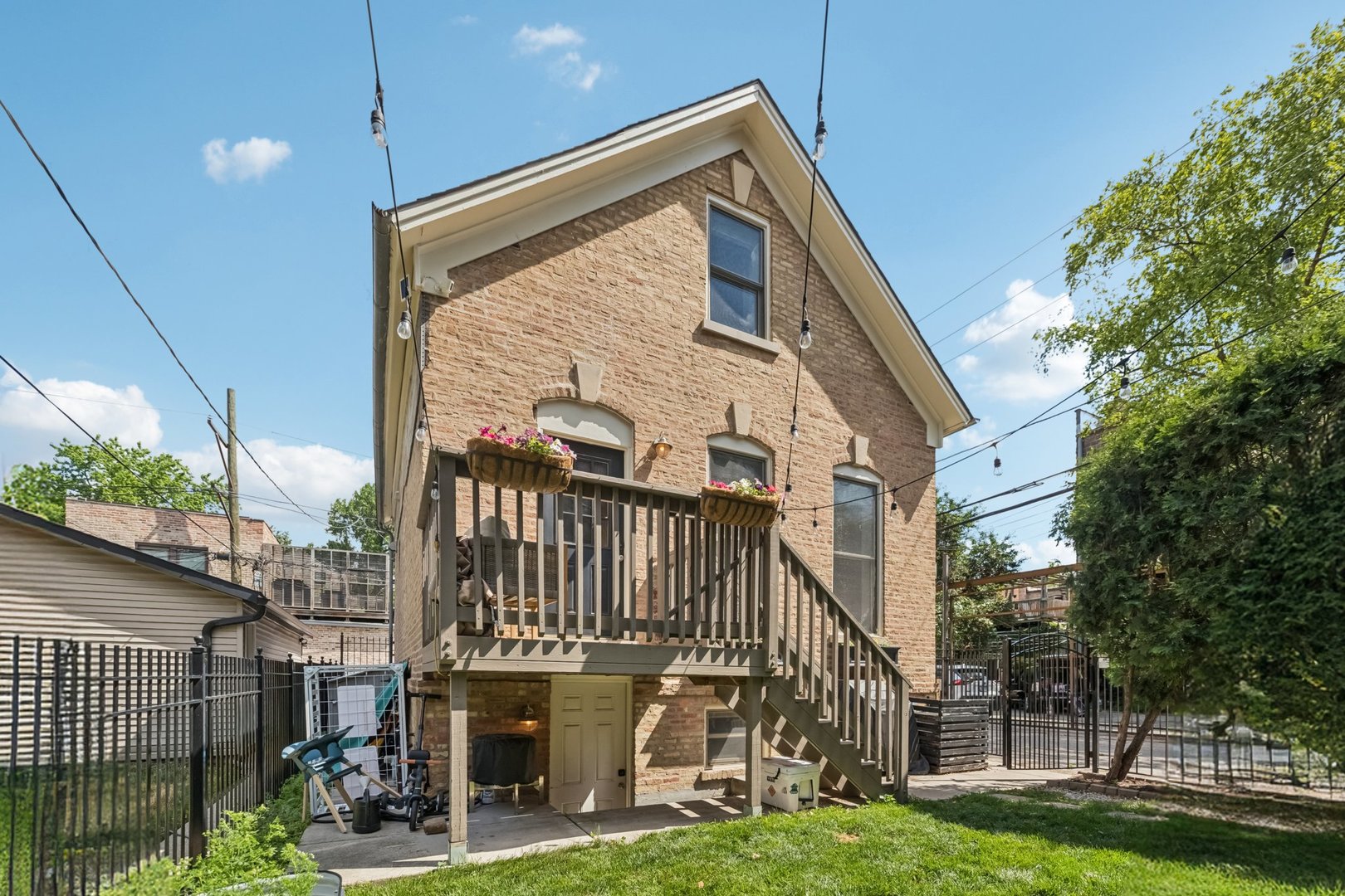 Discover this rare, fully renovated freestanding Coach House located in the center of Wicker Park.   This sun-drenched home offers three levels of well-appointed living space. The main level features an open-concept living and dining area with hardwood floors and a designer powder room with Kohler fixtures. The updated kitchen includes quartz countertops, stainless steel appliances, abundant cabinetry, and a large island.  The upper-level primary suite includes a sitting area or office space, two custom California Closets, and a beautifully updated ensuite with separate tub and shower. The lower level offers two spacious bedrooms, full laundry, and exterior access.  Additional features include hardwood floors throughout, recessed lighting, a front deck, and private front yard. Unbeatable location just steps to the Blue Line, CTA, restaurants, shops, and the park.  Low HOA fee and parking available for rent.