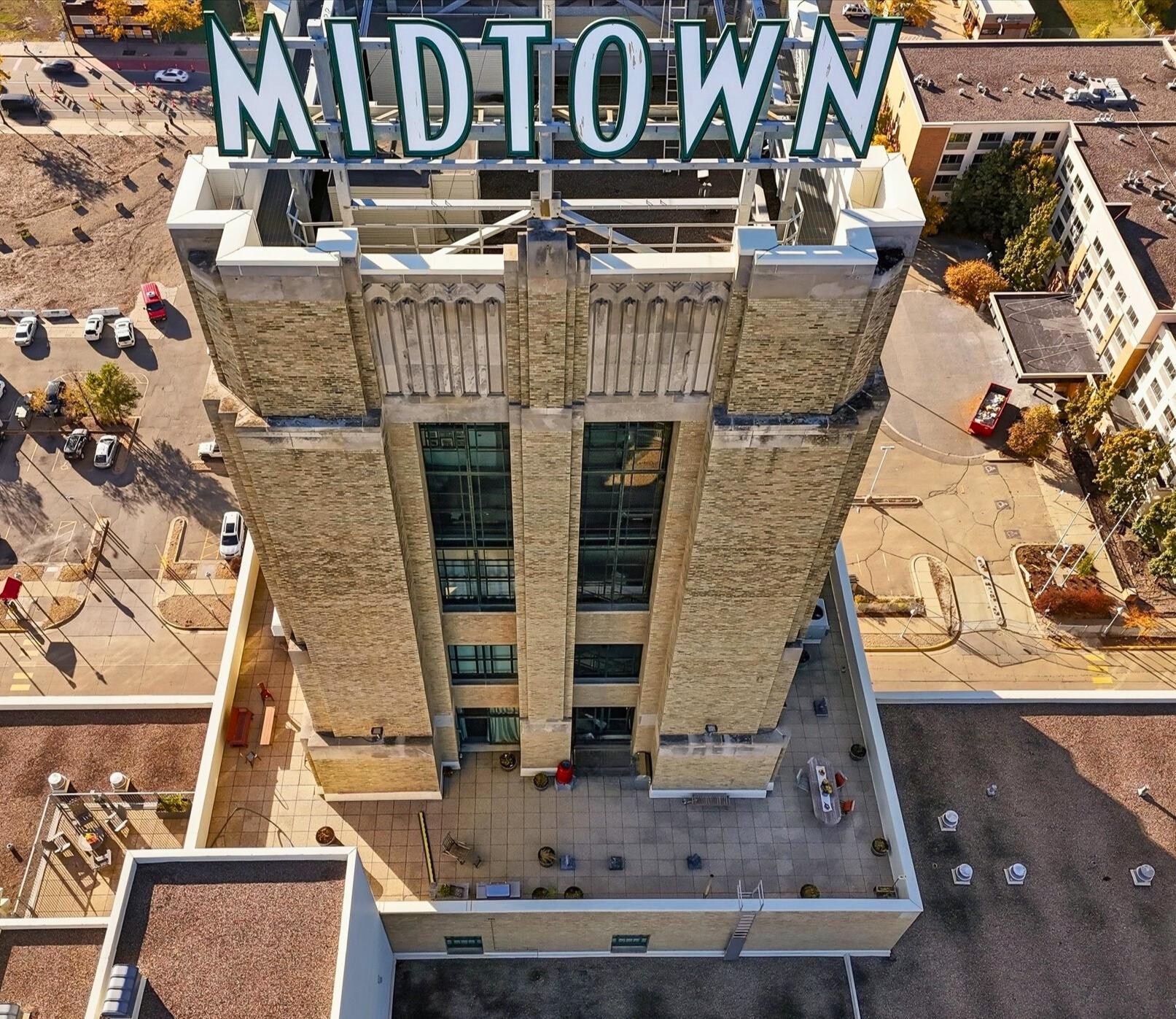 Iconic Full Floor Penthouse with the Largest Private Rooftop Terrace in Minneapolis! At 1,580 sq ft of interior living space the historic former Sears Building’s 15th floor is an extraordinary loft penthouse offering unmatched privacy, dramatic architecture, and 360-degree skyline views. With 2,300 sq ft of private rooftop terrace, this home is believed to feature the largest private rooftop terrace in all of Minneapolis. Perfect for entertaining, gardening, grilling, dining, or simply taking in sunrise to sunset views, this unmatched outdoor living space is truly unique.This one-of-a-kind residence blends exposed brick, soaring 14' ceilings, floor to ceiling windows, and heated concrete floors. Architectural upgrades feature refined Scandinavian industrial elements creating a space that feels both warm, modern, and timeless.Enjoy private elevator access from the 12th floor, exposed brick, custom lighting, and postcard views. Settle into the living room with a built in library, TV niche, and clear liquid fireplace. The sunny and spacious bedroom has an en suite, private rooftop access and a walk in California Closet. The penthouse has two beautifully finished bathrooms with ceramic tile and a walk-in shower. Enjoy the open kitchen with cherry cabinetry, granite countertops, huge island, new stainless steel appliances, and a gas range. In unit laundry, two underground parking spaces with Ev Charger, basement storage unit.Building Amenities include a Rooftop community room with patio, grill, seating, and resident planter boxes, a media room, fitness center, 24- hour security, and a bike storage roomLive above the vibrant Midtown Global Market, offering global cuisine, boutique shops, and year round entertainment right downstairs. The Midtown Greenway is at the end of the block, Powderhorn Park is two blocks away, and major freeways and public transit are easily accessible. Pets are welcome!